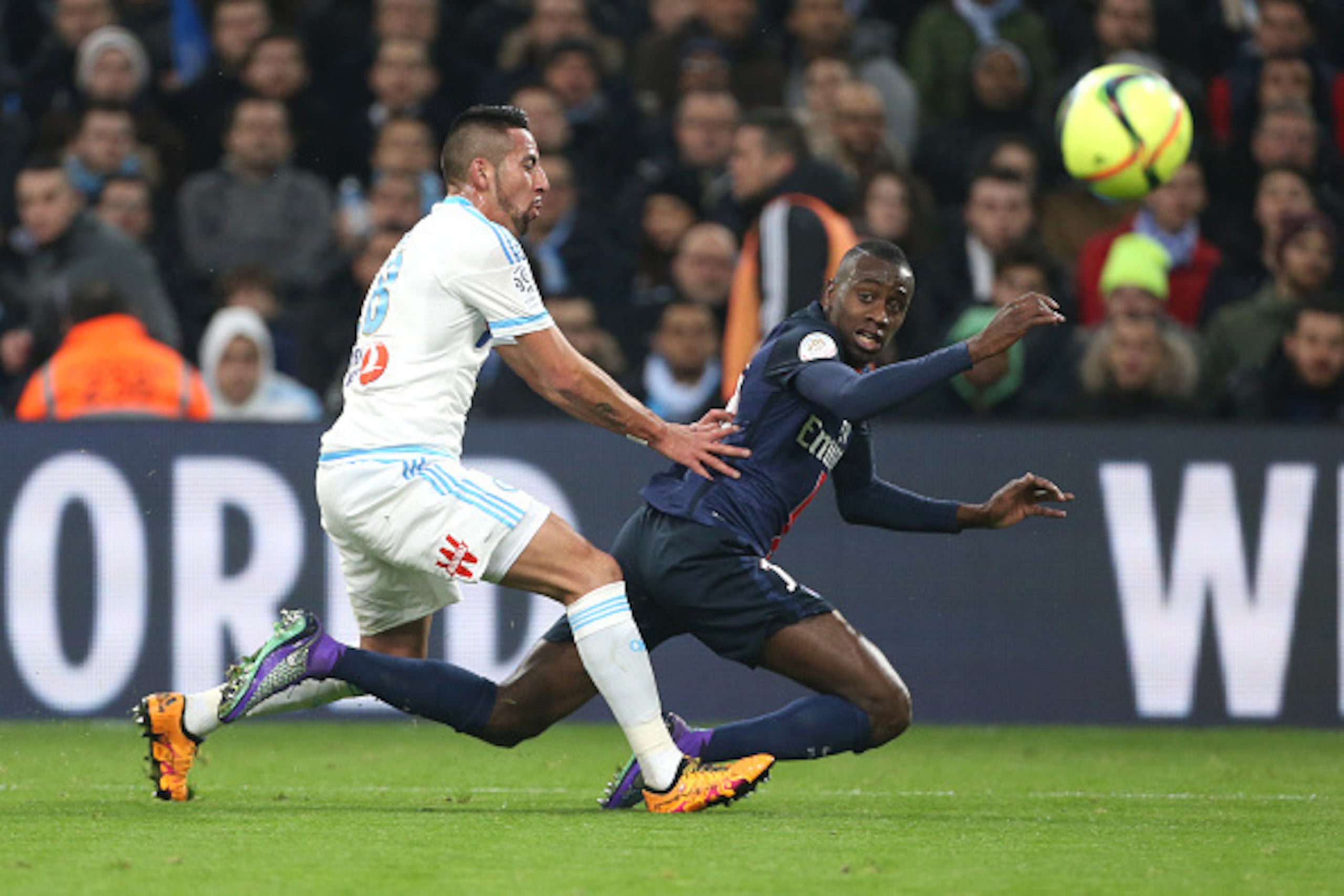 MARSEILLE - FEBRUARY 7: Mauricio Anibal Isla Isla of OM and Blaise Matuidi of PSG in action during the French Ligue 1 match between Olympique de Marseille (OM) and Paris Saint-Germain (PSG) at New Stade Velodrome on February 7, 2016 in Marseille, France. 