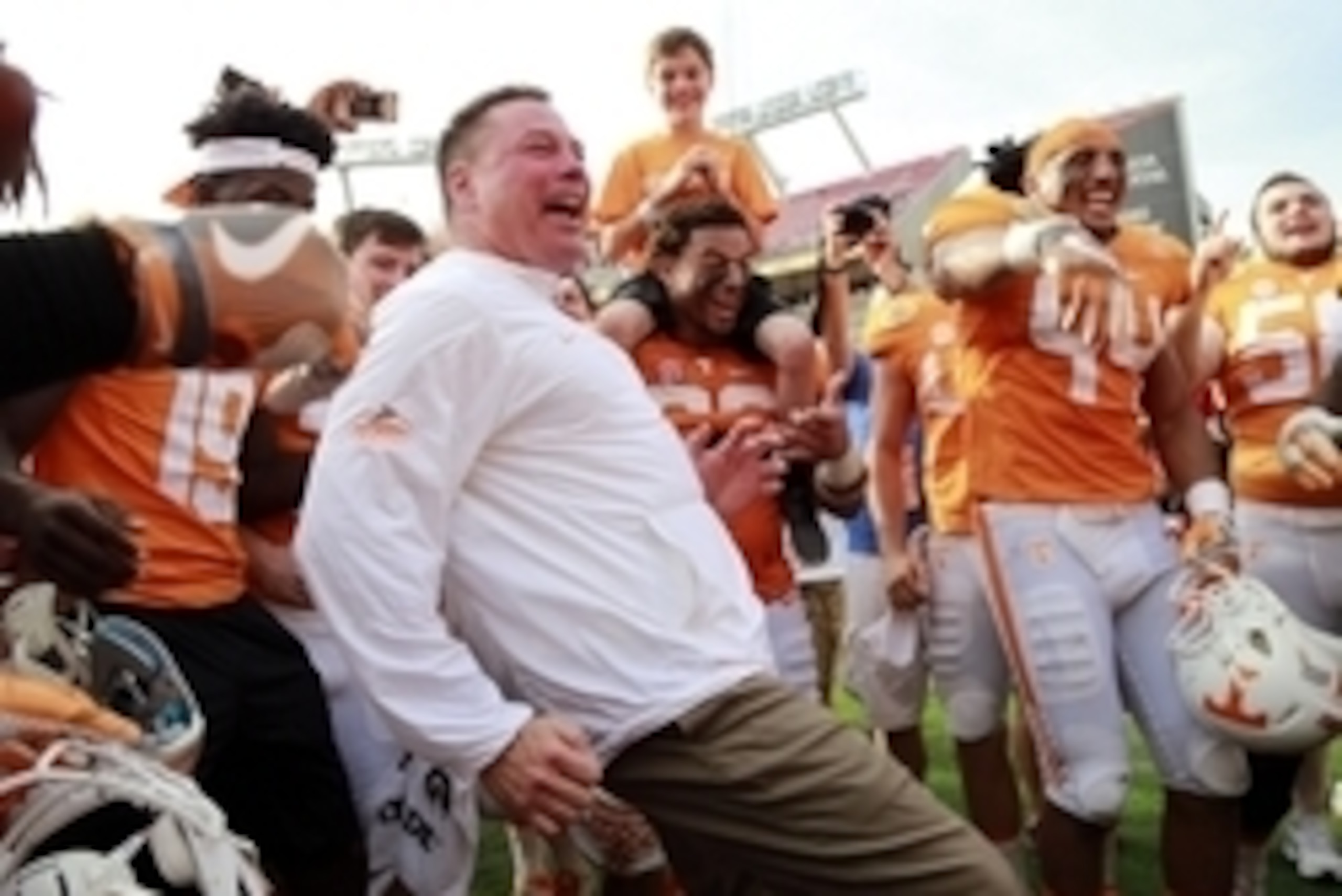Jan 1, 2016; Tampa, FL, USA; Tennessee Volunteers head coach Butch Jones and  his team celebrate as they beat the Northwestern Wildcats in the 2016 Outback Bowl at Raymond James Stadium. Tennessee Volunteers defeated the Northwestern Wildcats 45-6. Tennes