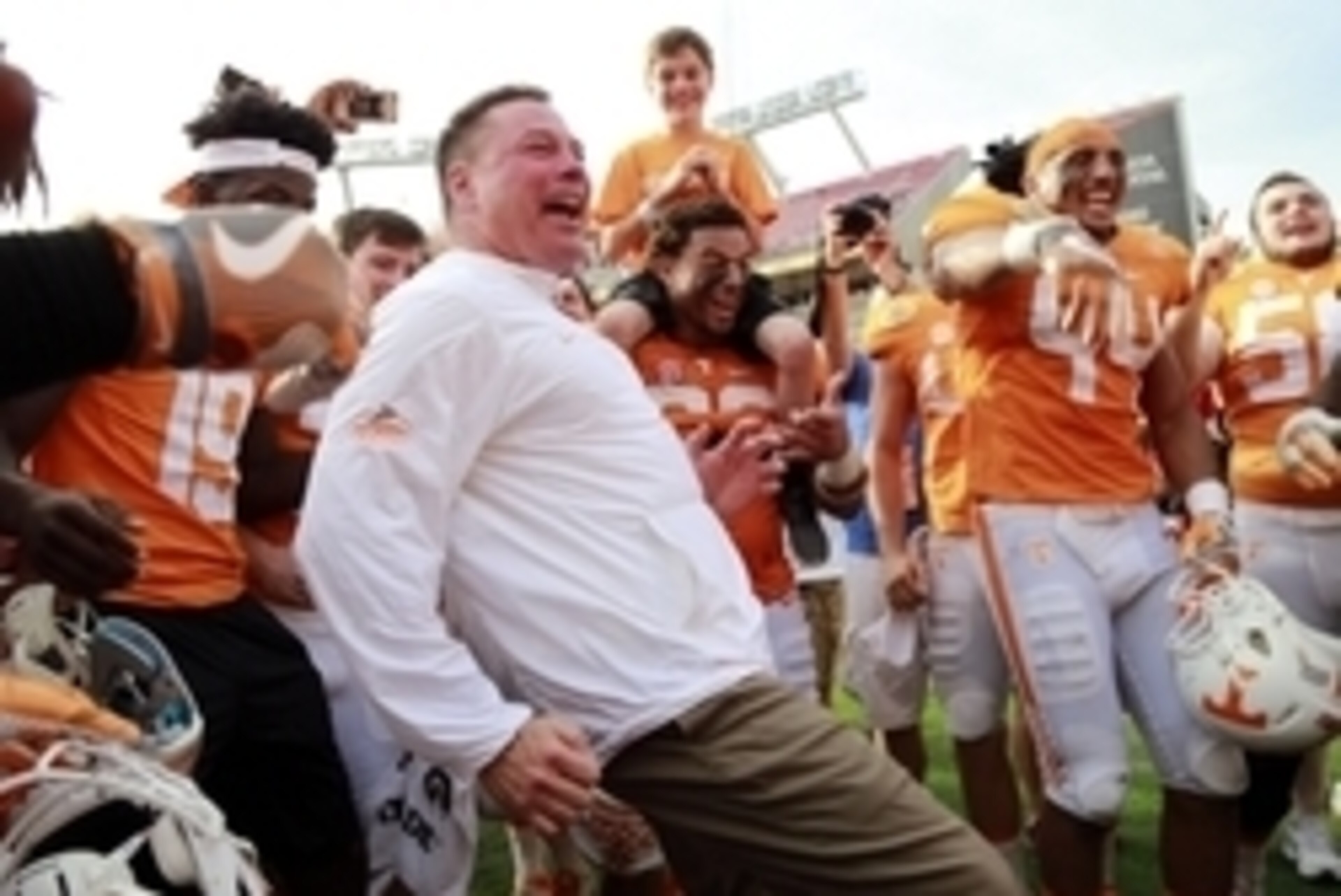 Jan 1, 2016; Tampa, FL, USA; Tennessee Volunteers head coach Butch Jones and  his team celebrate as they beat the Northwestern Wildcats in the 2016 Outback Bowl at Raymond James Stadium. Tennessee Volunteers defeated the Northwestern Wildcats 45-6. Tennes