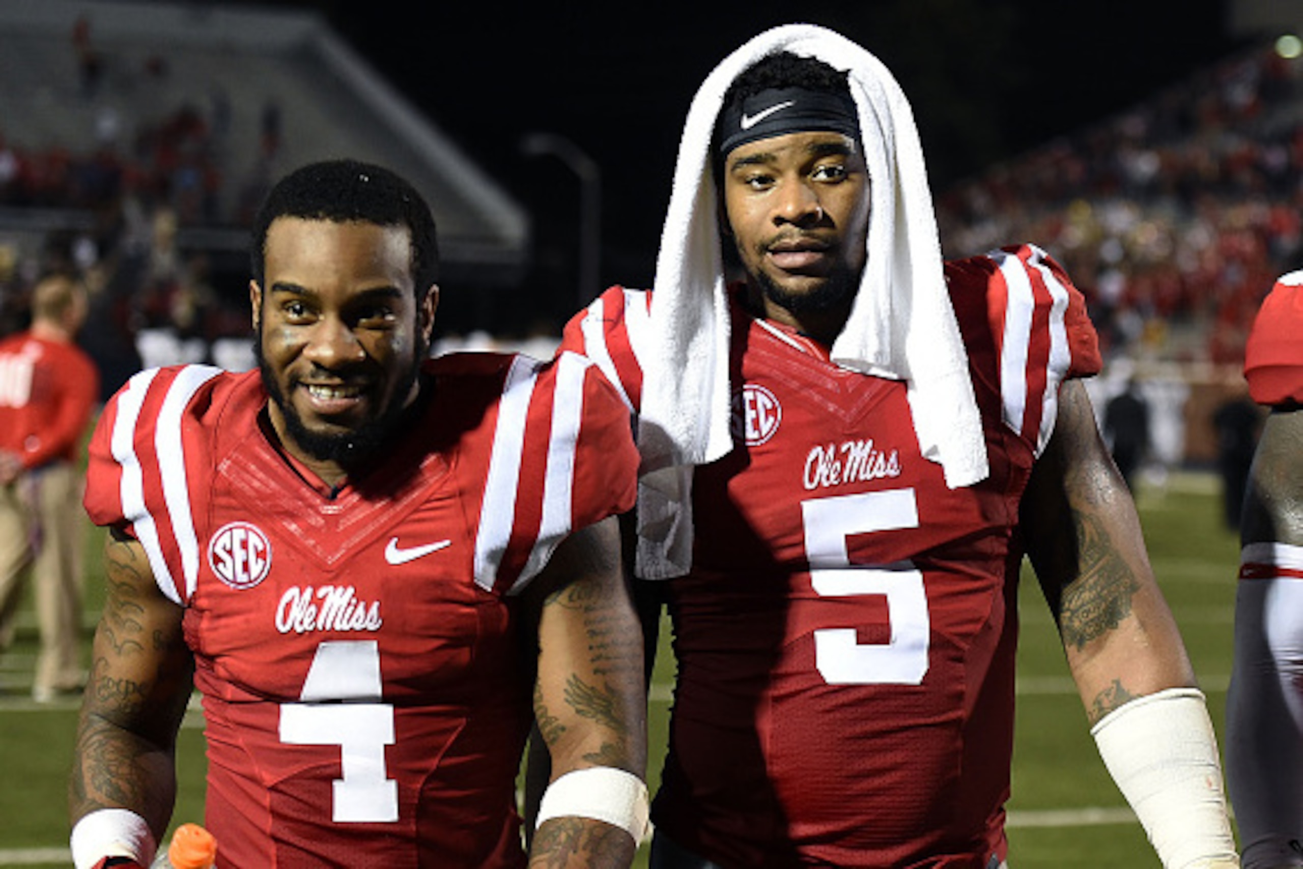 OXFORD, MS - SEPTEMBER 26:  Denzel Nkemdiche #4 and his brother Robert Nkemdiche #5 of the Mississippi Rebels leave the field following a game against the Vanderbilt Commodores at Vaught-Hemingway Stadium on September 26, 2015 in Oxford, Mississippi.  Mis