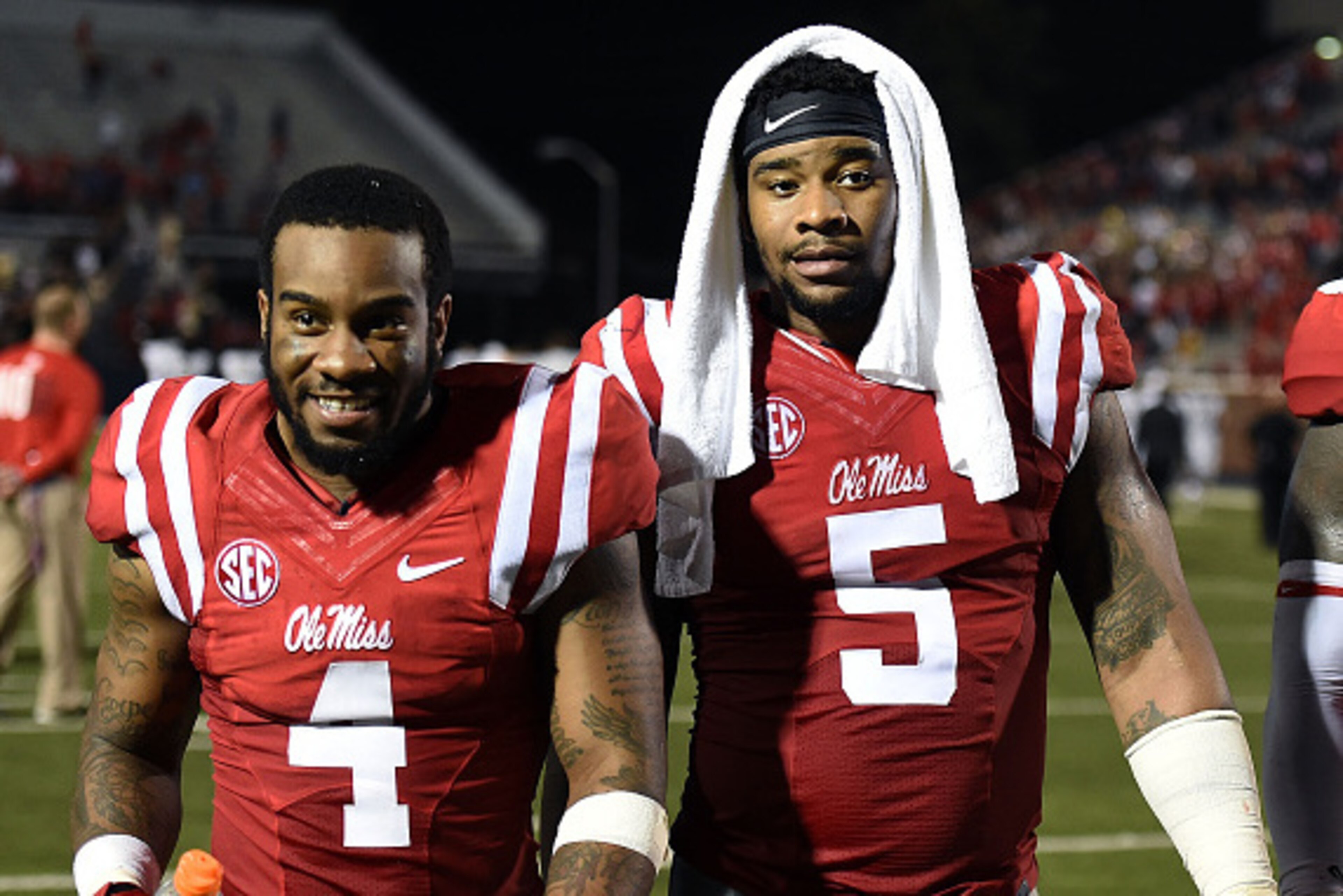OXFORD, MS - SEPTEMBER 26:  Denzel Nkemdiche #4 and his brother Robert Nkemdiche #5 of the Mississippi Rebels leave the field following a game against the Vanderbilt Commodores at Vaught-Hemingway Stadium on September 26, 2015 in Oxford, Mississippi.  Mis
