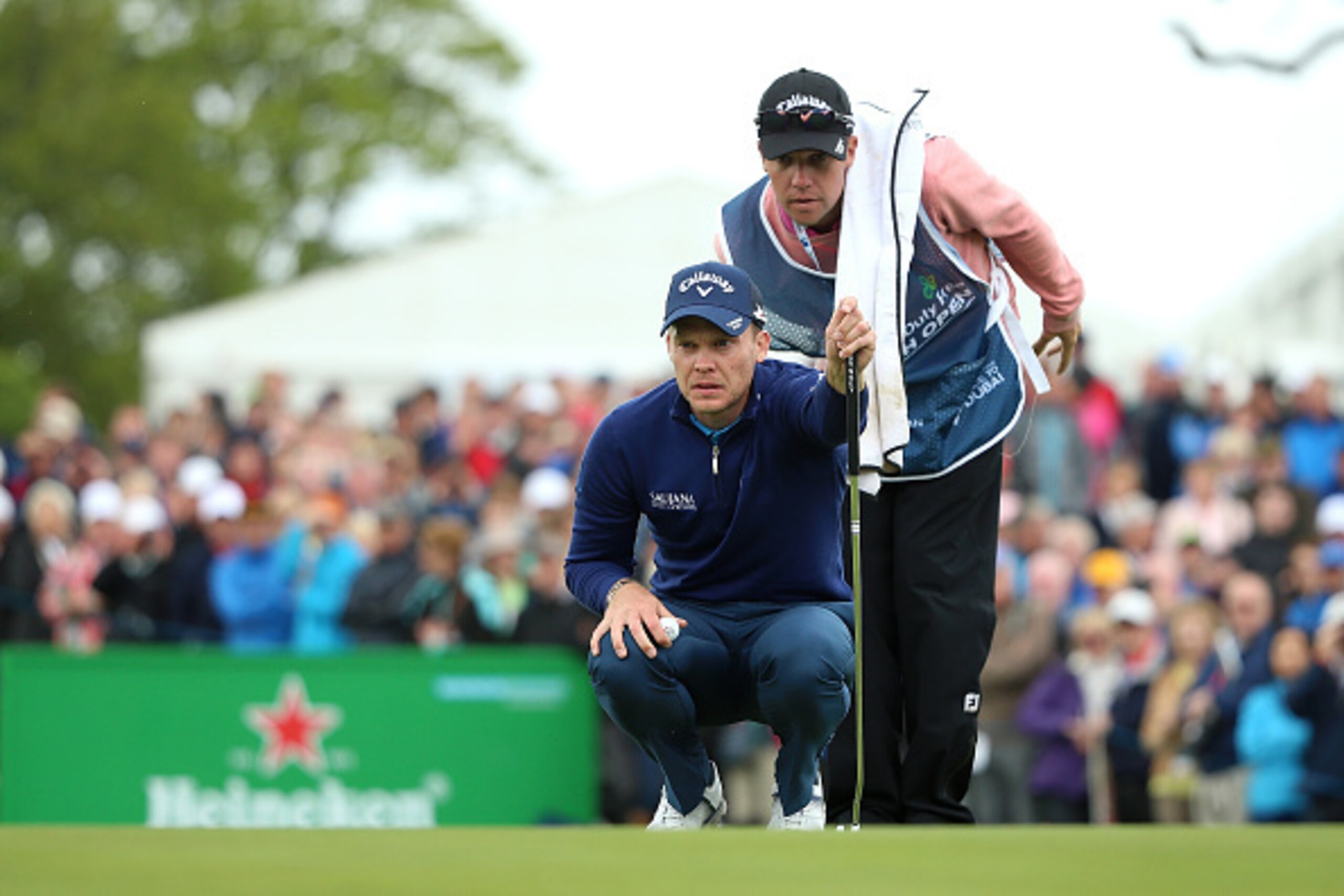 STRAFFAN, IRELAND - MAY 20:  Danny Willett of England lines up a putt with caddie Jonathan Smart on the 9th green during the second round of the Dubai Duty Free Irish Open Hosted by the Rory Foundation at The K Club on May 20, 2016 in Straffan, Ireland.  