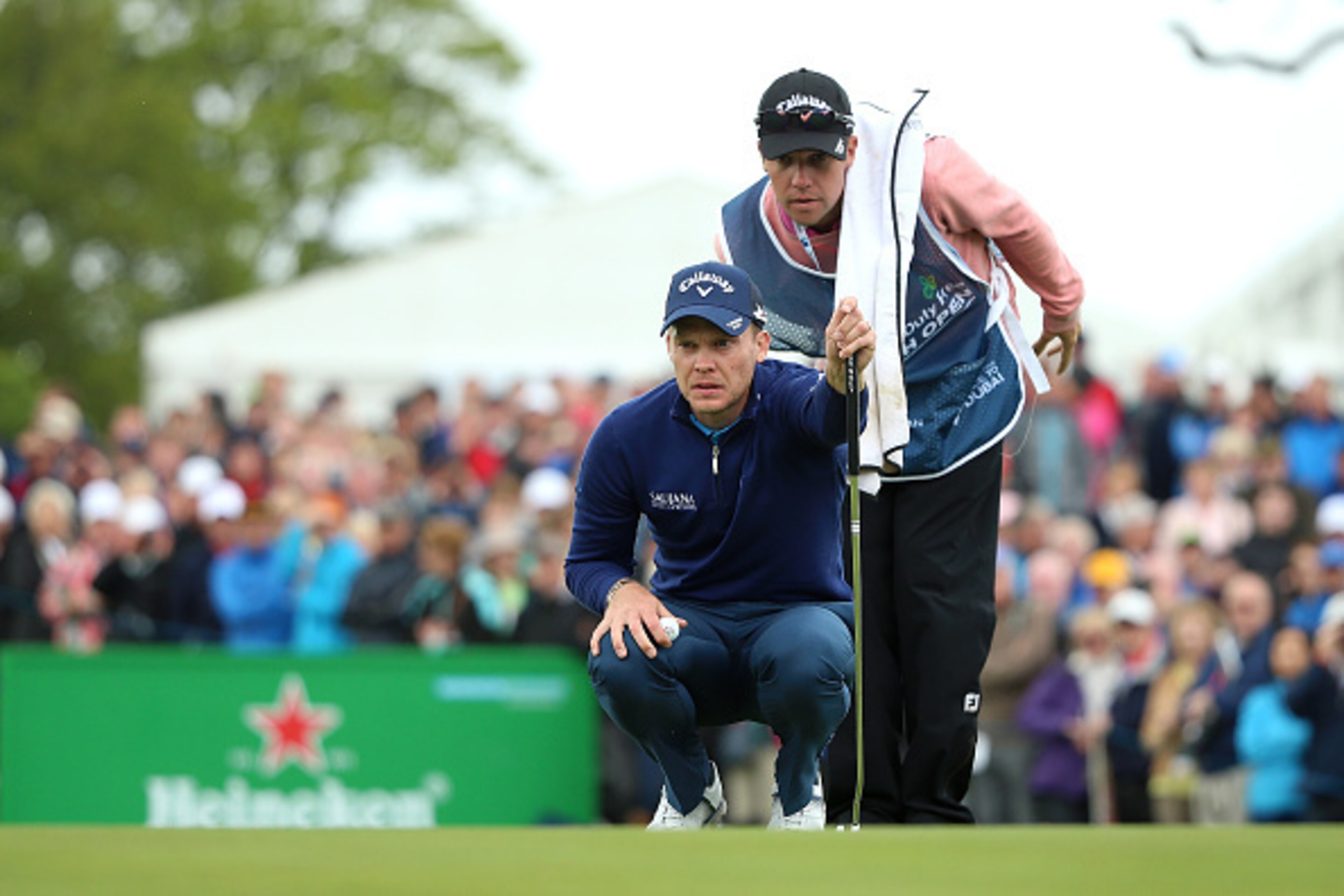 STRAFFAN, IRELAND - MAY 20: Danny Willett of England lines up a putt with caddie Jonathan Smart on the 9th green during the second round of the Dubai Duty Free Irish Open Hosted by the Rory Foundation at The K Club on May 20, 2016 in Straffan, Ireland. STRAFFAN, IRELAND - MAY 20: Danny Willett of England lines up a putt with caddie Jonathan Smart on the 9th green during the second round of the Dubai Duty Free Irish Open Hosted by the Rory Foundation at The K Club on May 20, 2016 in Straffan, Ireland.