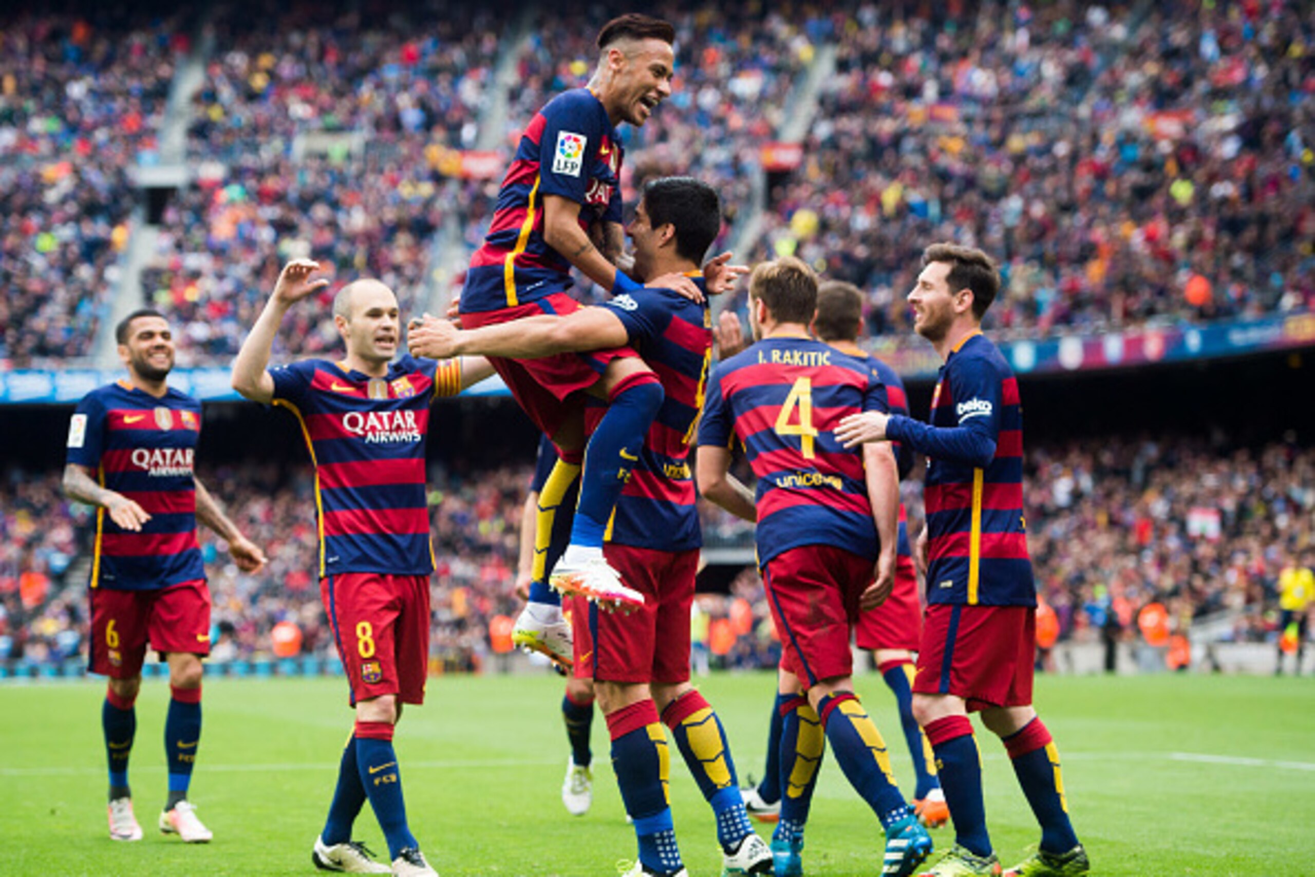 BARCELONA, SPAIN - MAY 08:  (L-R) Dani Alves, Andres Iniesta, Neymar Santos Jr, Ivan Rakitic and Lionel Messi of FC Barcelona celebrate with their teammate Luis Suarez (C) after scoring his team's third goal during the La Liga match between FC Barcelona a