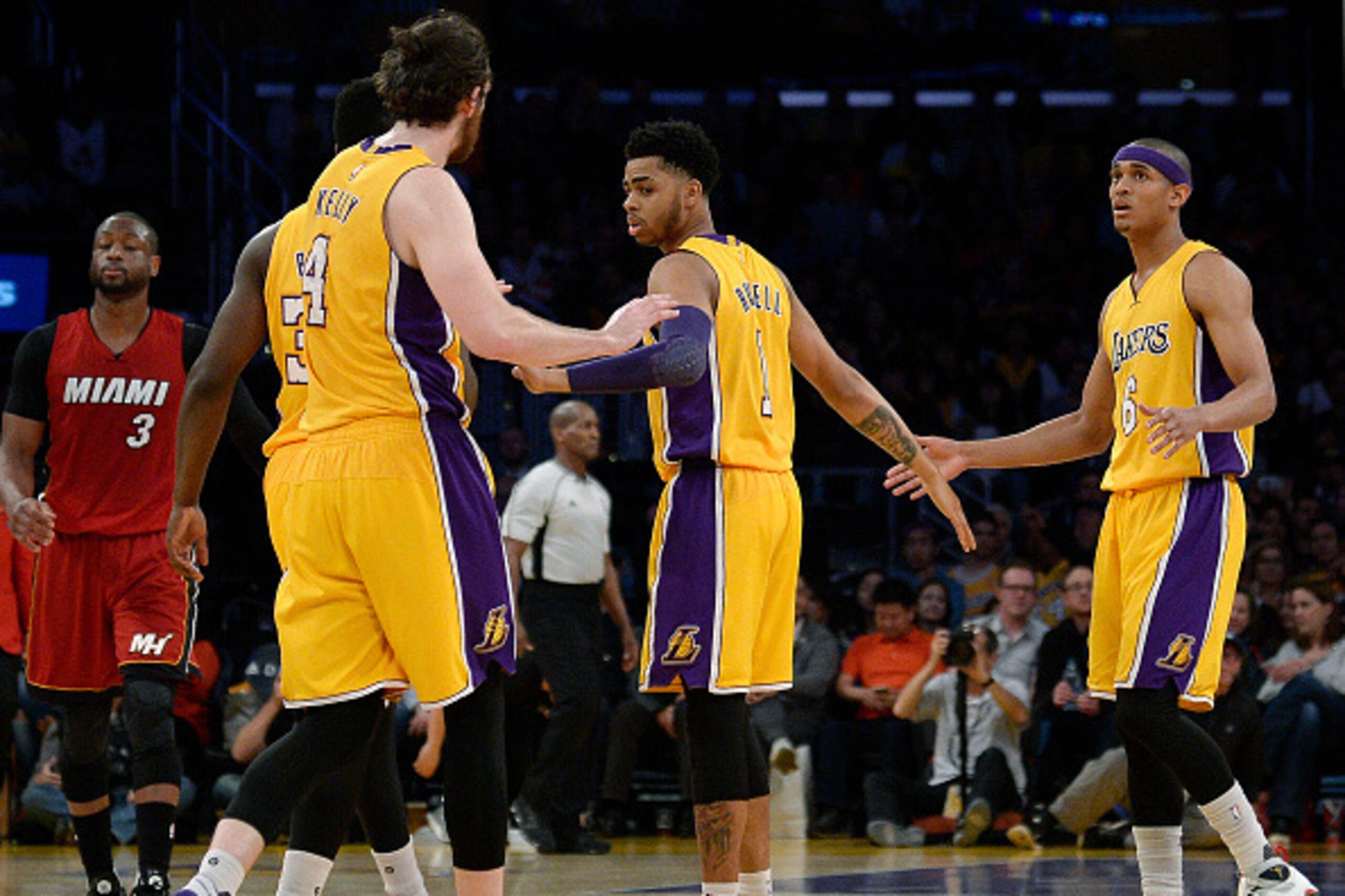 LOS ANGELES, CA - MARCH 30: D'Angelo Russell #1 of the Los Angeles Lakers is congratulated by his teammates Jordan Clarkson #6 and Ryan Kelly #4 during the basketball game at Staples Center March 30, 2016, in Los Angeles, California. NOTE TO USER: User ex