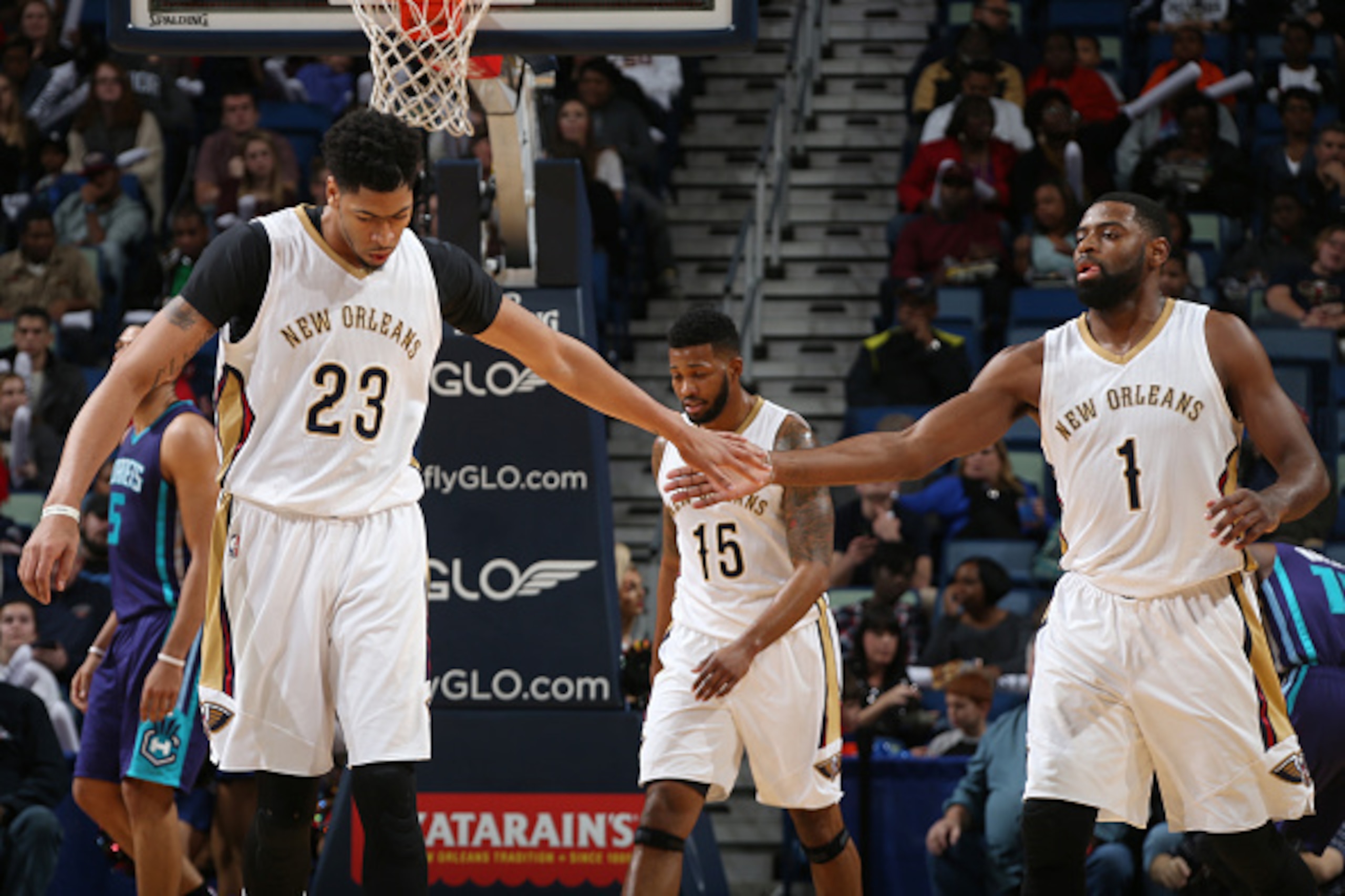 NEW ORLEANS, LA - JANUARY 15: Anthony Davis #23 high fives teammate Tyreke Evans #1 of the New Orleans Pelicans during the game against the Charlotte Hornets on January 15, 2016 at Smoothie King Center in New Orleans, Louisiana. NOTE TO USER: User express