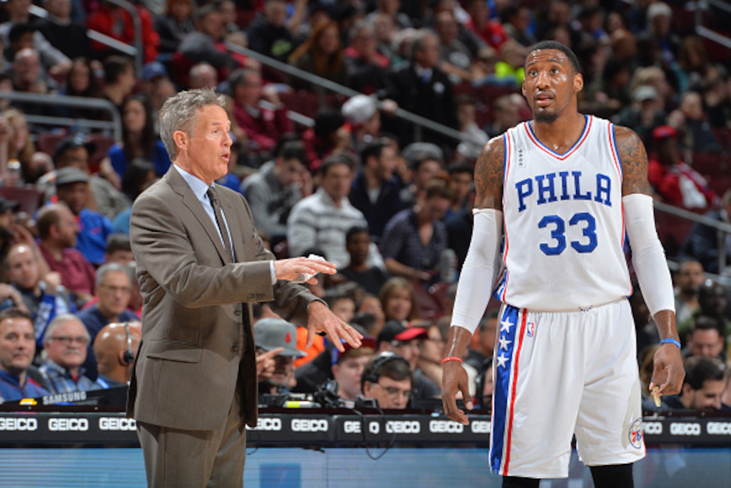 PHILADELPHIA,PA - JANUARY 16: Head Coach Brett Brown speaks with Robert Covington #33 of the Philadelphia 76ers against the Portland Trail Blazers at Wells Fargo Center on January 16, 2015 in Philadelphia, Pennsylvania NOTE TO USER: User expressly acknowl