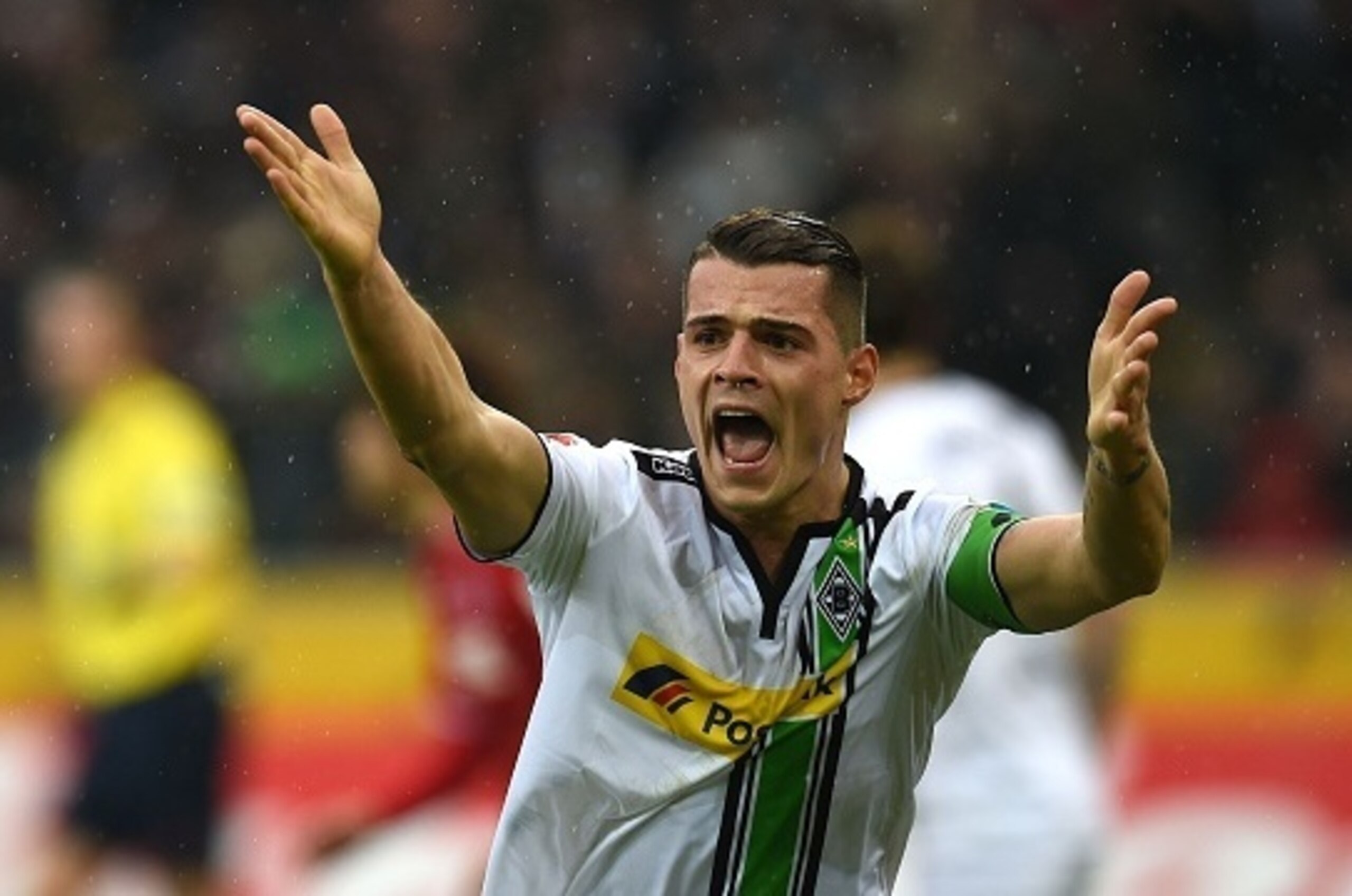 Moenchengladbach's Swiss midfielder Granit Xhaka reacts during the German first division Bundesliga football match Borussia Moenchengladbach vs 1. FC Cologne in Moenchengladbach , western Germany, on February  20, 2016. / AFP / PATRIK STOLLARZ / RESTRICTI