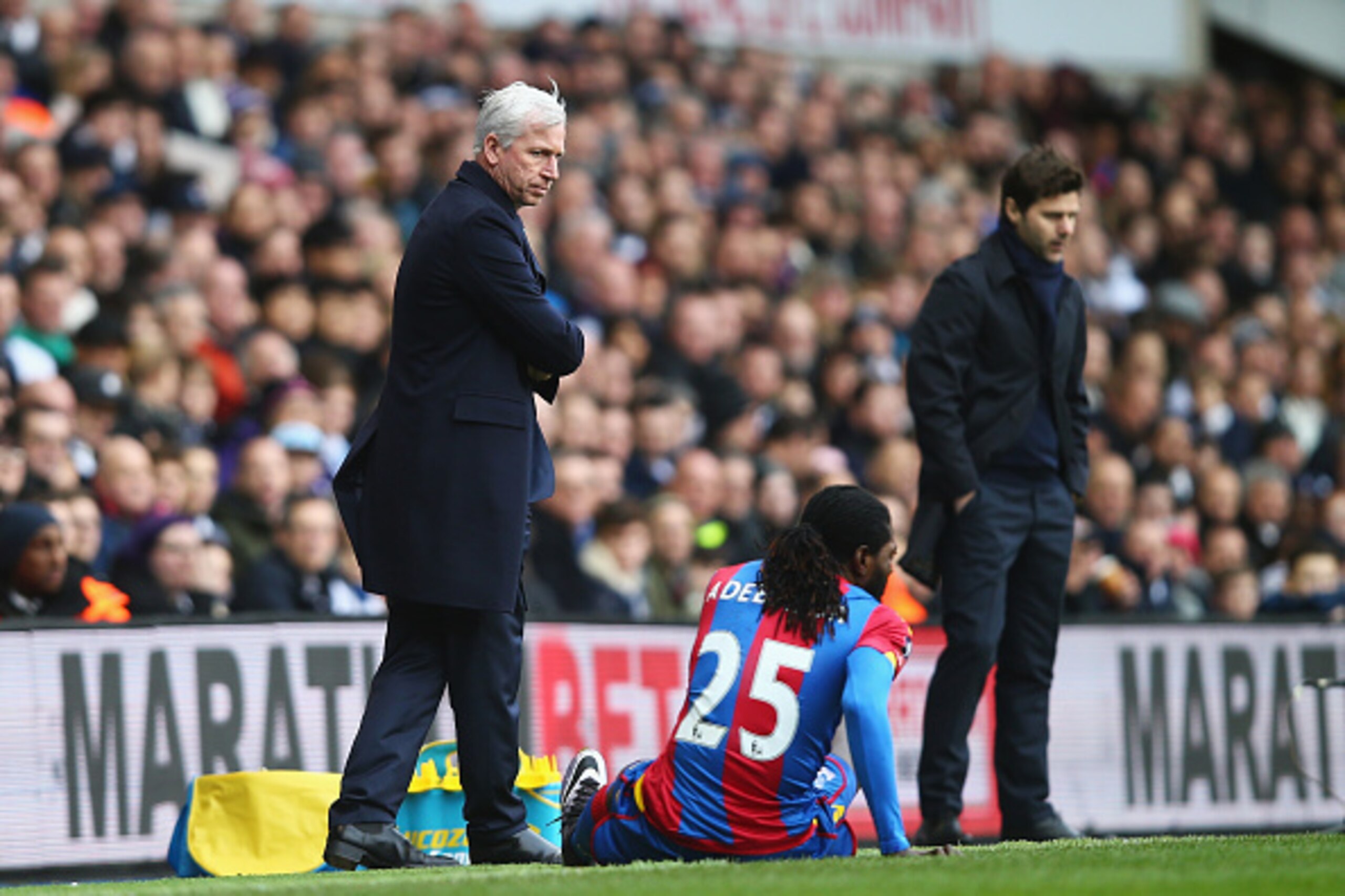 LONDON, ENGLAND - FEBRUARY 21: Alan Pardew, Manager of Crystal Palace talks to Emmanuel Adebayor of Crystal Palace with Mauricio Pochettino, Manager of Tottenham Hotspur during the Emirates FA Cup Fifth Round match between Tottenham Hotspur and Crystal P LONDON, ENGLAND - FEBRUARY 21: Alan Pardew, Manager of Crystal Palace talks to Emmanuel Adebayor of Crystal Palace with Mauricio Pochettino, Manager of Tottenham Hotspur during the Emirates FA Cup Fifth Round match between Tottenham Hotspur and Crystal P