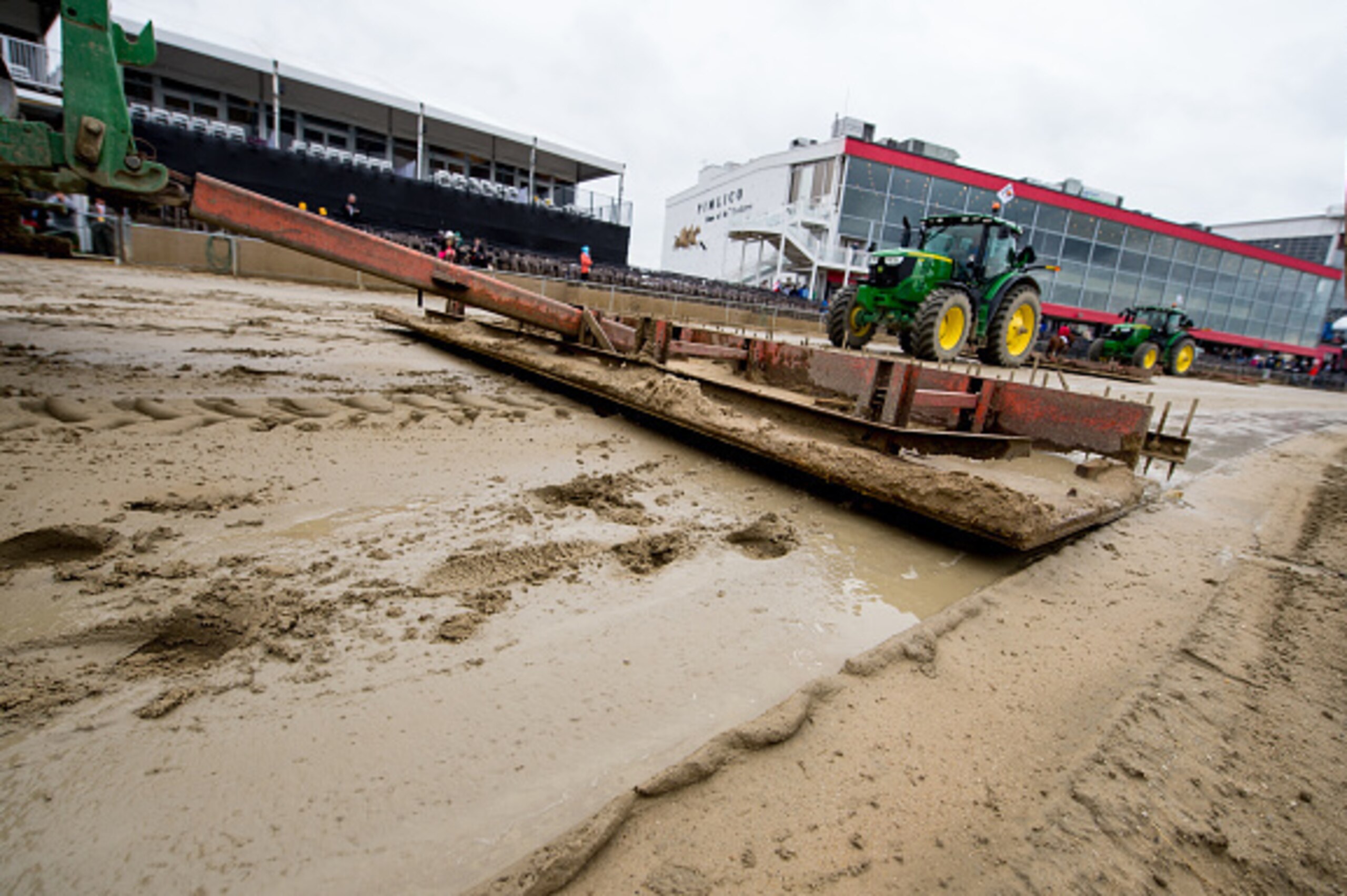 BALTIMORE, MD - MAY 21: Tractors work to maintain the wet track on a rainy Preakness Day at Pimlico Race Course on May 21, 2016 in Baltimore, Maryland. (Photo by Amy K. Dragoo/Eclipse Sportswire/Getty Images)