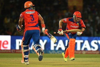 Gujarat Lions' Brendon McCullum (R) and Suresh Raina run between the wickets during the 2016 Indian Premier League (IPL) Twenty20 cricket match between Gujarat Lions and Mumbai Indians at Green Park stadium in Kanpur on May 21, 2016. --IMAGE RESTRICTED TO