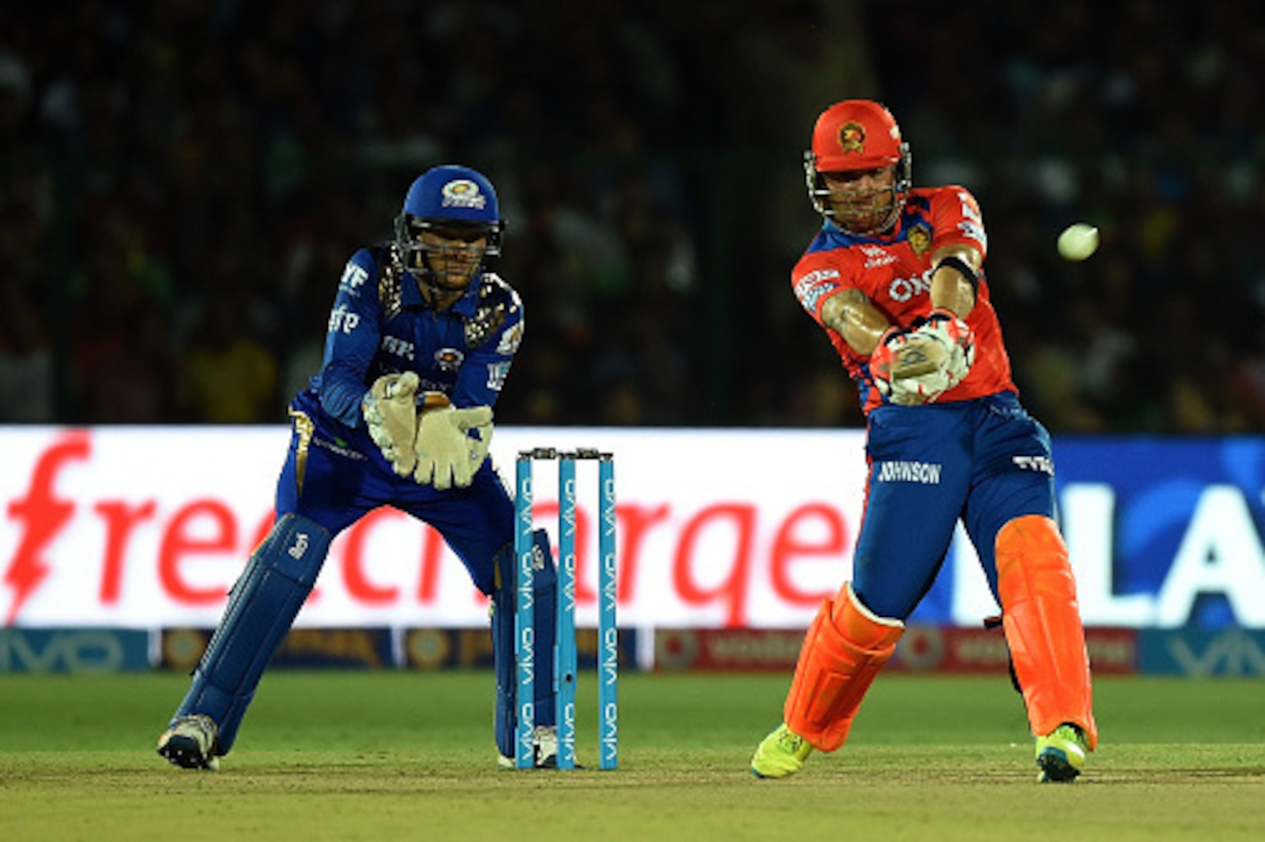 Gujarat Lions' Brendon McCullum (R) plays a shot during the 2016 Indian Premier League (IPL) Twenty20 cricket match between Gujarat Lions and Mumbai Indians at Green Park stadium in Kanpur on May 21, 2016. --IMAGE RESTRICTED TO EDITORIAL USE - STRICTLY NO