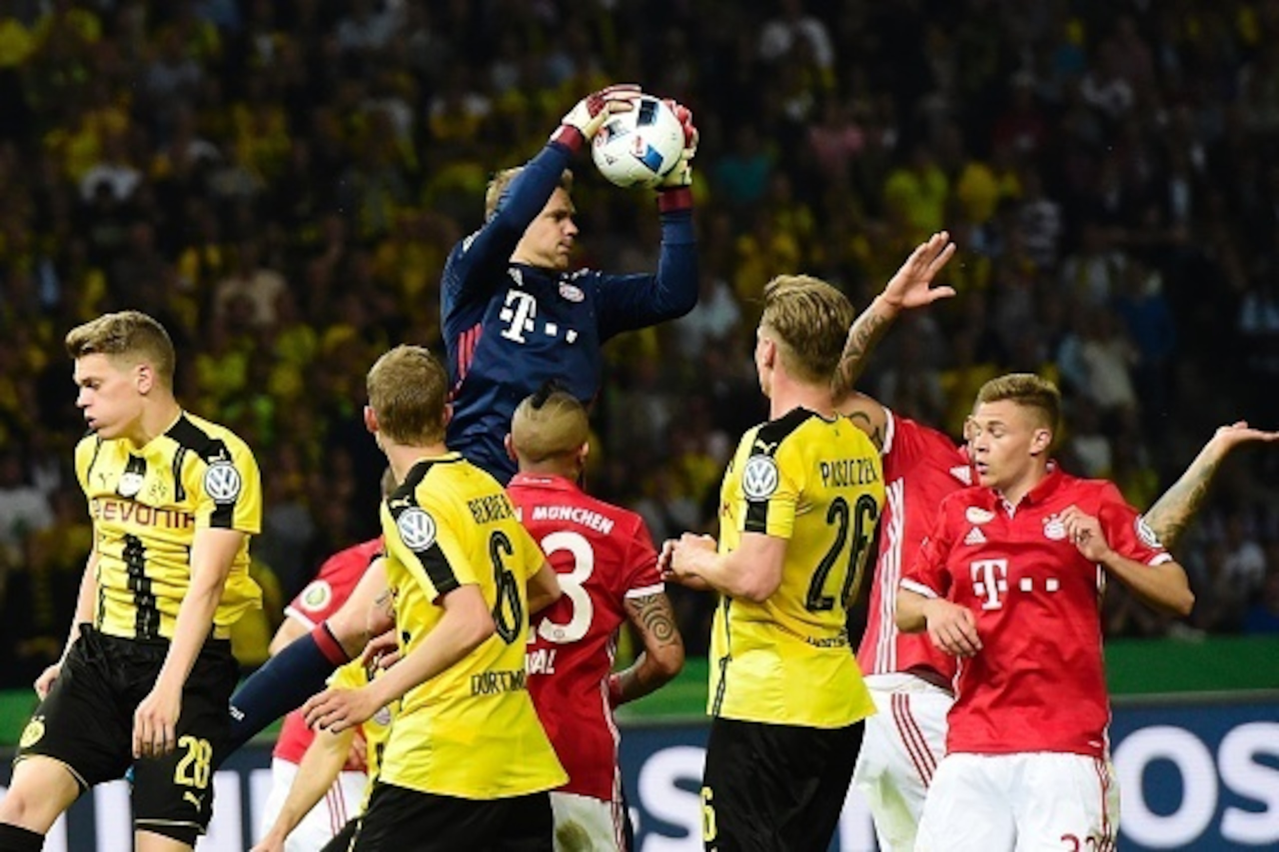Bayern Munich's goalkeeper Manuel Neuer makes a save during the German Cup (DFB Pokal) final football match Bayern Munich vs Borussia Dortmund at the Olympic stadium in Berlin on May 21, 2016. / AFP / TOBIAS SCHWARZ / RESTRICTIONS: ACCORDING TO DFB RULES 