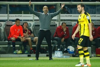 Bayern Munich's Spanish head coach Pep Guardiola reacts during the German Cup (DFB Pokal) final football match Bayern Munich vs Borussia Dortmund at the Olympic stadium in Berlin on May 21, 2016. / AFP / ODD ANDERSEN / RESTRICTIONS: ACCORDING TO DFB RULES