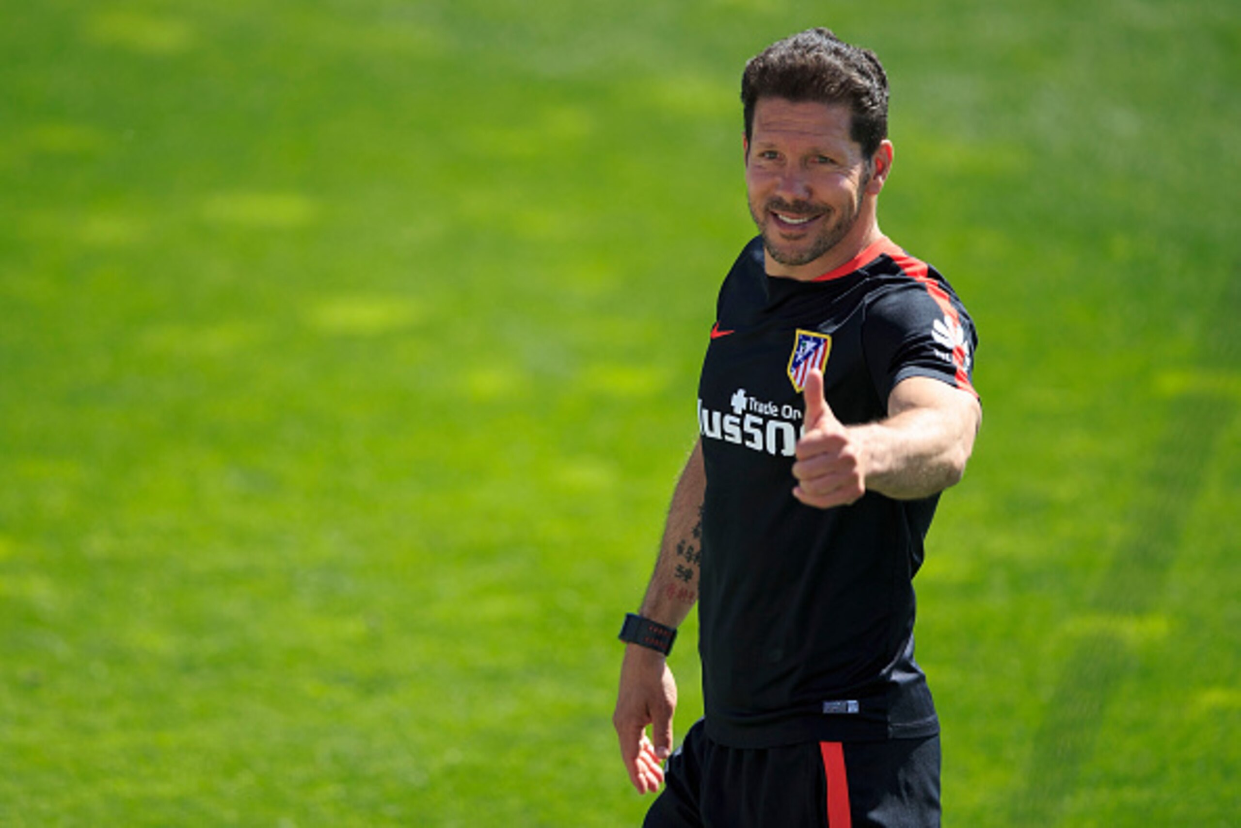 MADRID, SPAIN - MAY 21: Head coach Diego Pablo Simeone gives the ok to the audience as he leaves the training session during the Club Atletico de Madrid Open Media Day ahead of the UEFA Champions League Final match against Real Madrid CF on May 21, 2016 i