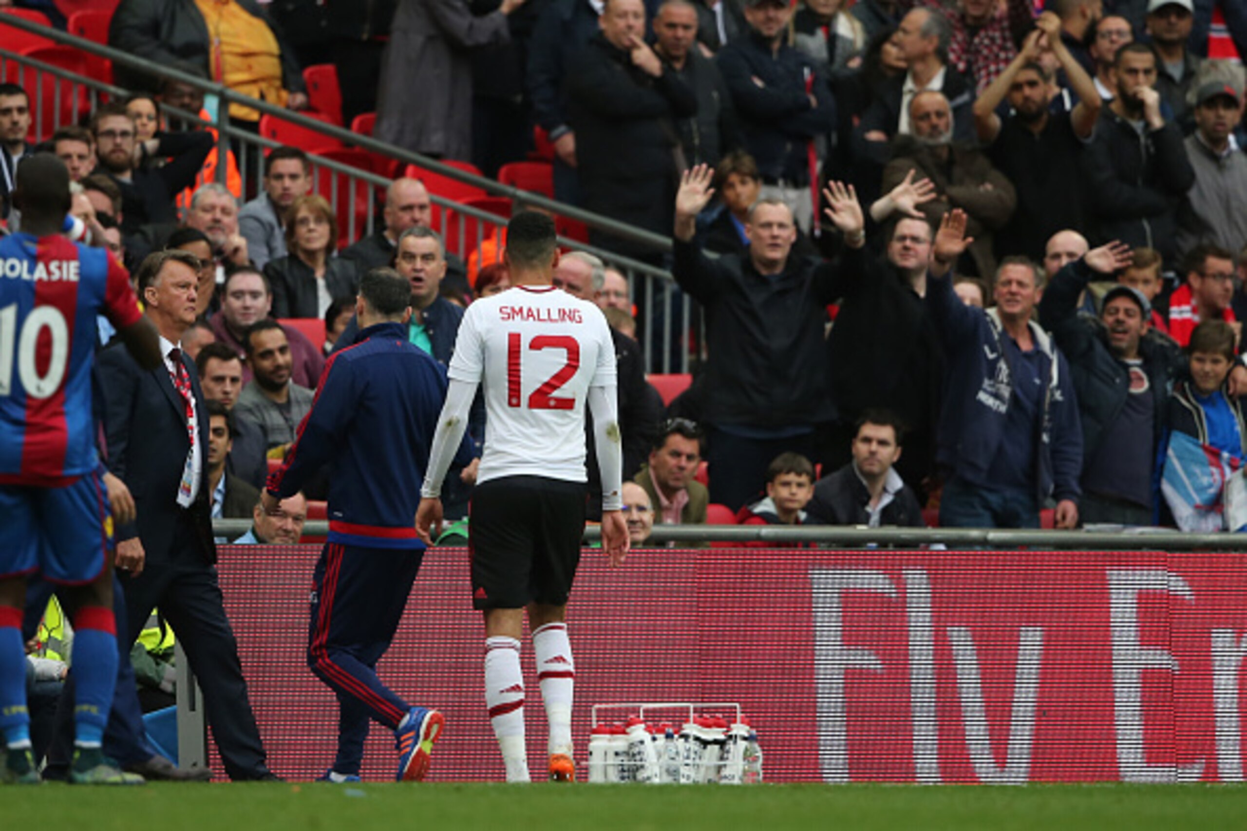 LONDON, ENGLAND - MAY 21:   Chris Smalling of Manchester United walks off after being shown a red card during The Emirates FA Cup final match between Manchester United and Crystal Palace at Wembley Stadium on May 21, 2016 in London, England.  (Photo by Ma