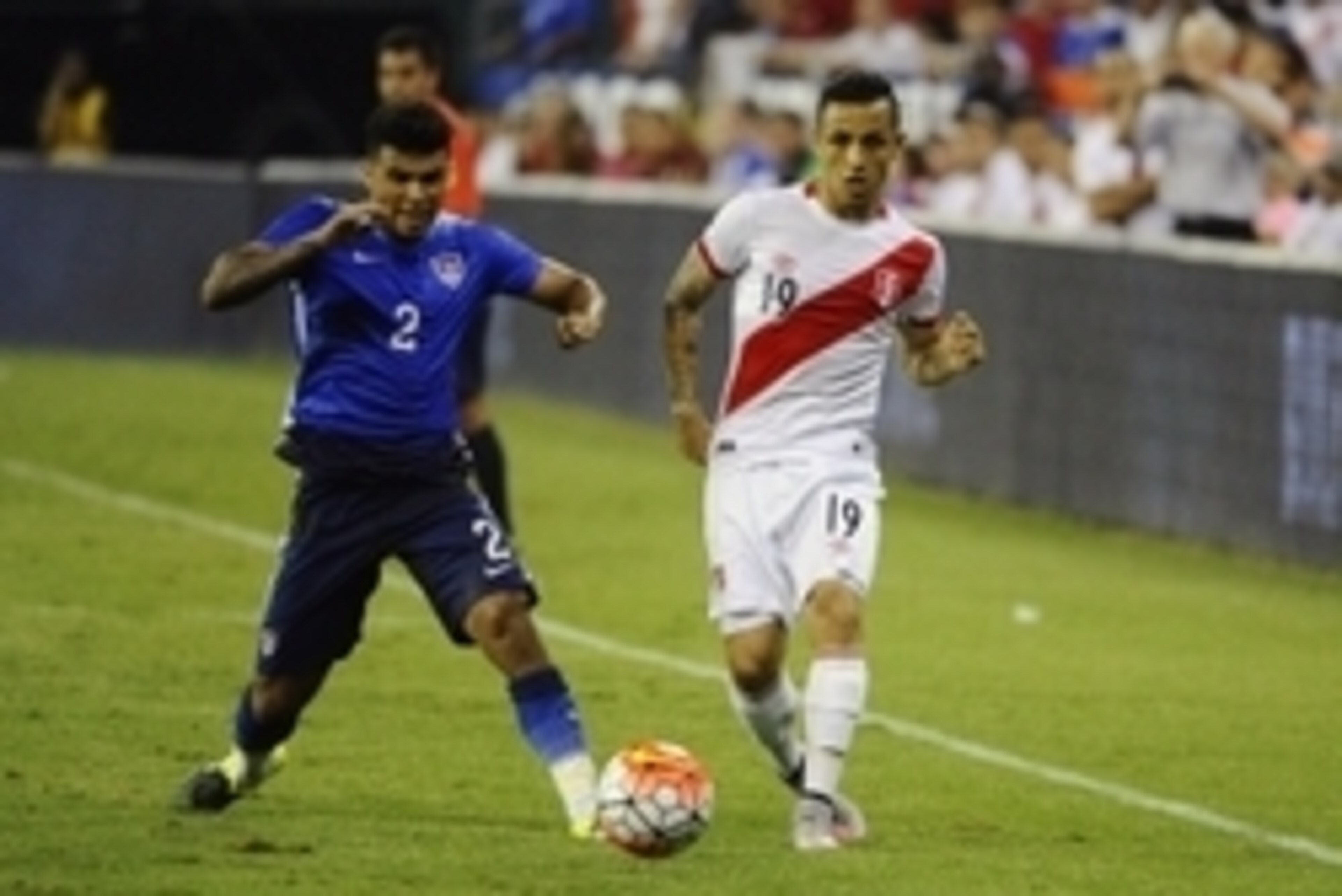 Sep 4, 2015; Landover, MD, USA; United States defender DeAndre Yedlin (2) and Peru defender Victor Yotun (19) chase the ball during the second half at RFK Stadium. The United States won 2 - 1. Mandatory Credit: Brad Mills-USA TODAY Sports