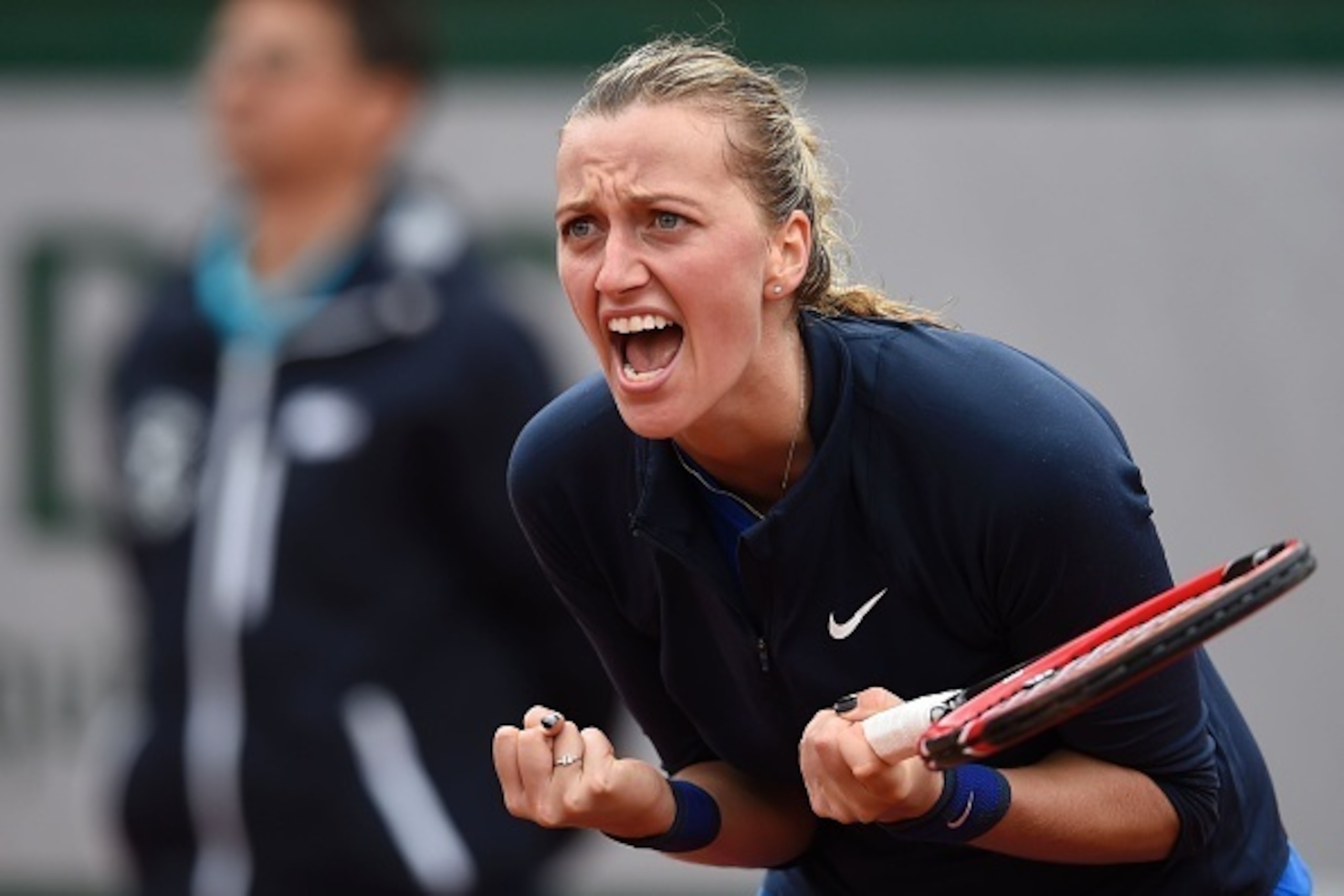 Czech Republic's Petra Kvitova reacts during her match against Montenegro's Danka Kovinic during their women's first round match at the Roland Garros 2016 French Tennis Open in Paris on May 22, 2016. / AFP / Eric FEFERBERG        (Photo credit should read