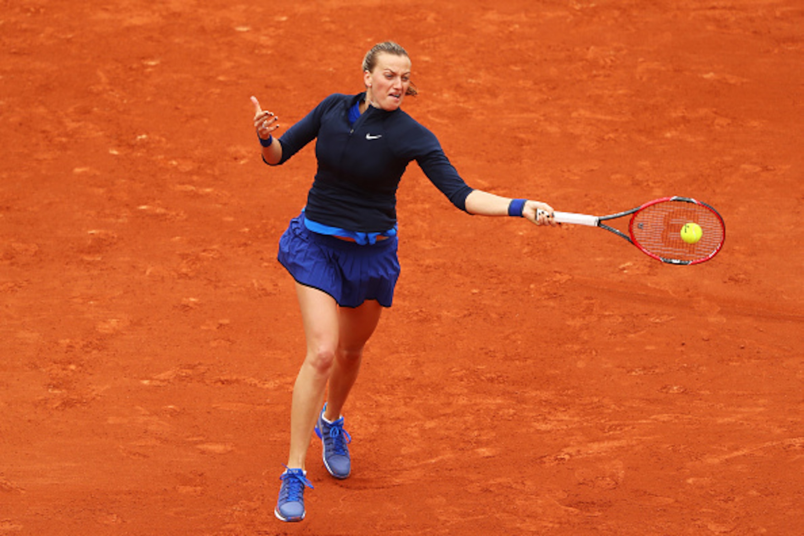 PARIS, FRANCE - MAY 22:  Petra Kvitova of the Czech Republic hits a forehand during the Womens Singles first round match against Danka Kovinic of Montenegro on day one of the 2016 French Open at Roland Garros on May 22, 2016 in Paris, France.  (Photo by J