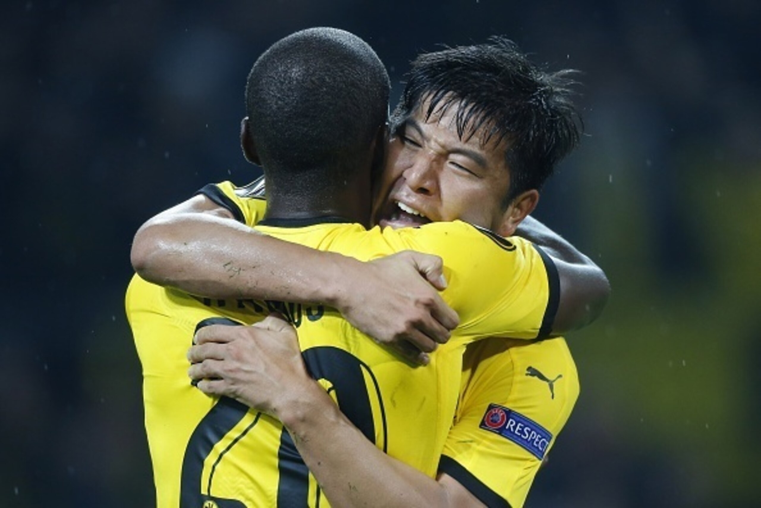 Dortmund's Korean defender Park Joo-Ho (R) celebrates with his teammate Dortmund's Columbian striker Adrian Ramos after scoring the 2-1 during the UEFA Europa League Group C football match between Borussia Dortmund and FC Krasnodar in Dortmund, western Ge