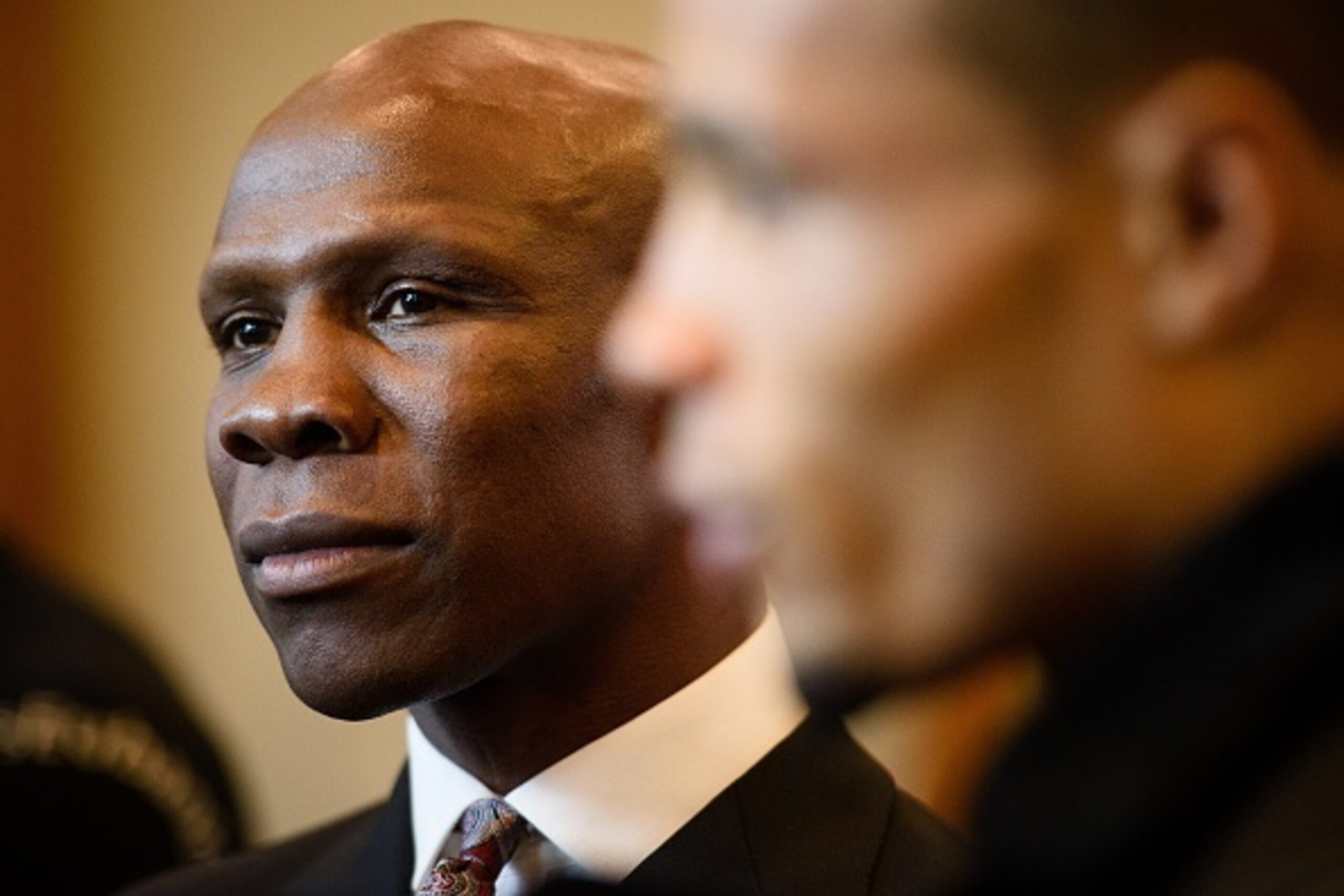 British boxer Chris Eubank Jr (R) and his father English, aka former boxing champion Chris Eubank Snr (L), are interviewed following a press conference in east London on December 10, 2015, promoting Eubank's upcoming non-title middleweight fight against I