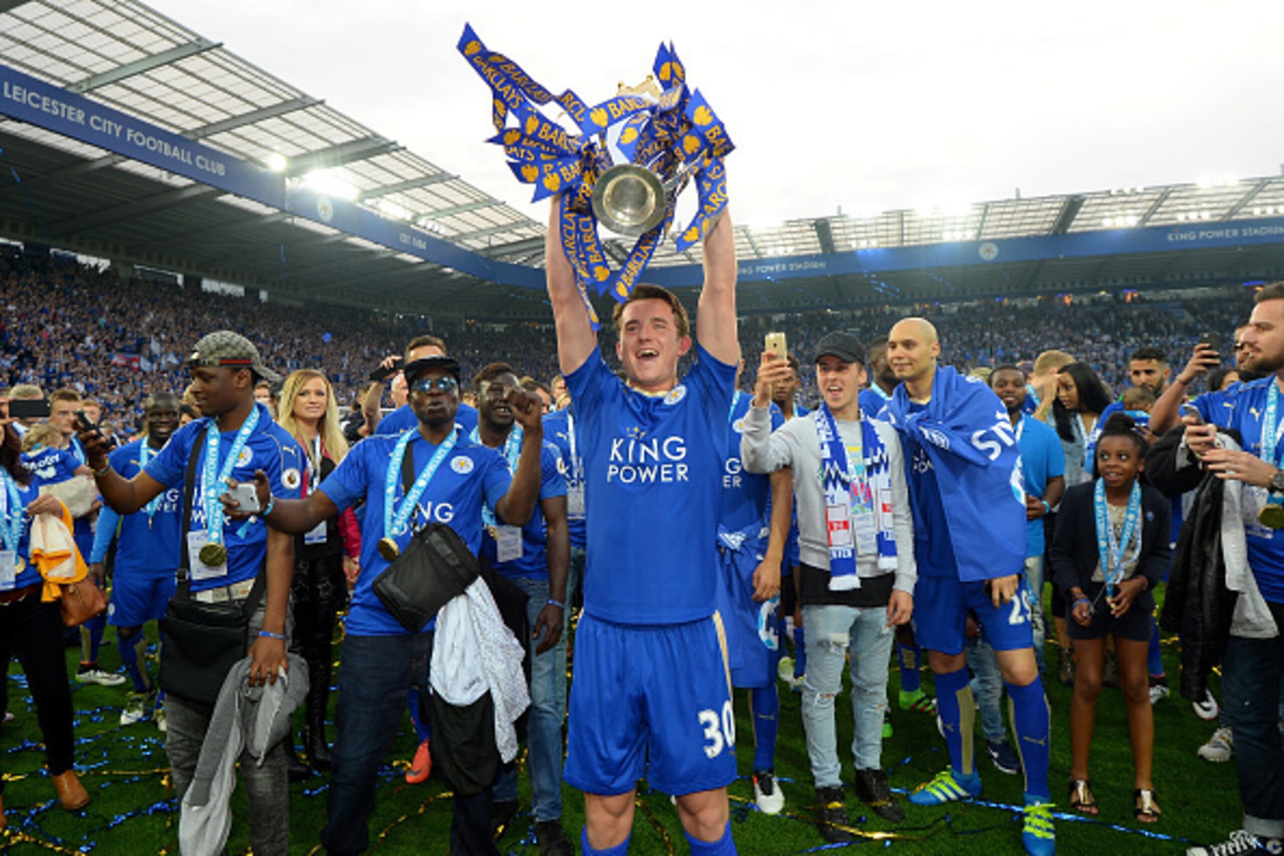 LEICESTER, ENGLAND - MAY 07:  Ben Chilwell of Leicester City lifts the Premier League Trophy as players and staffs celebrate the season champion after the Barclays Premier League match between Leicester City and Everton at The King Power Stadium on May 7,