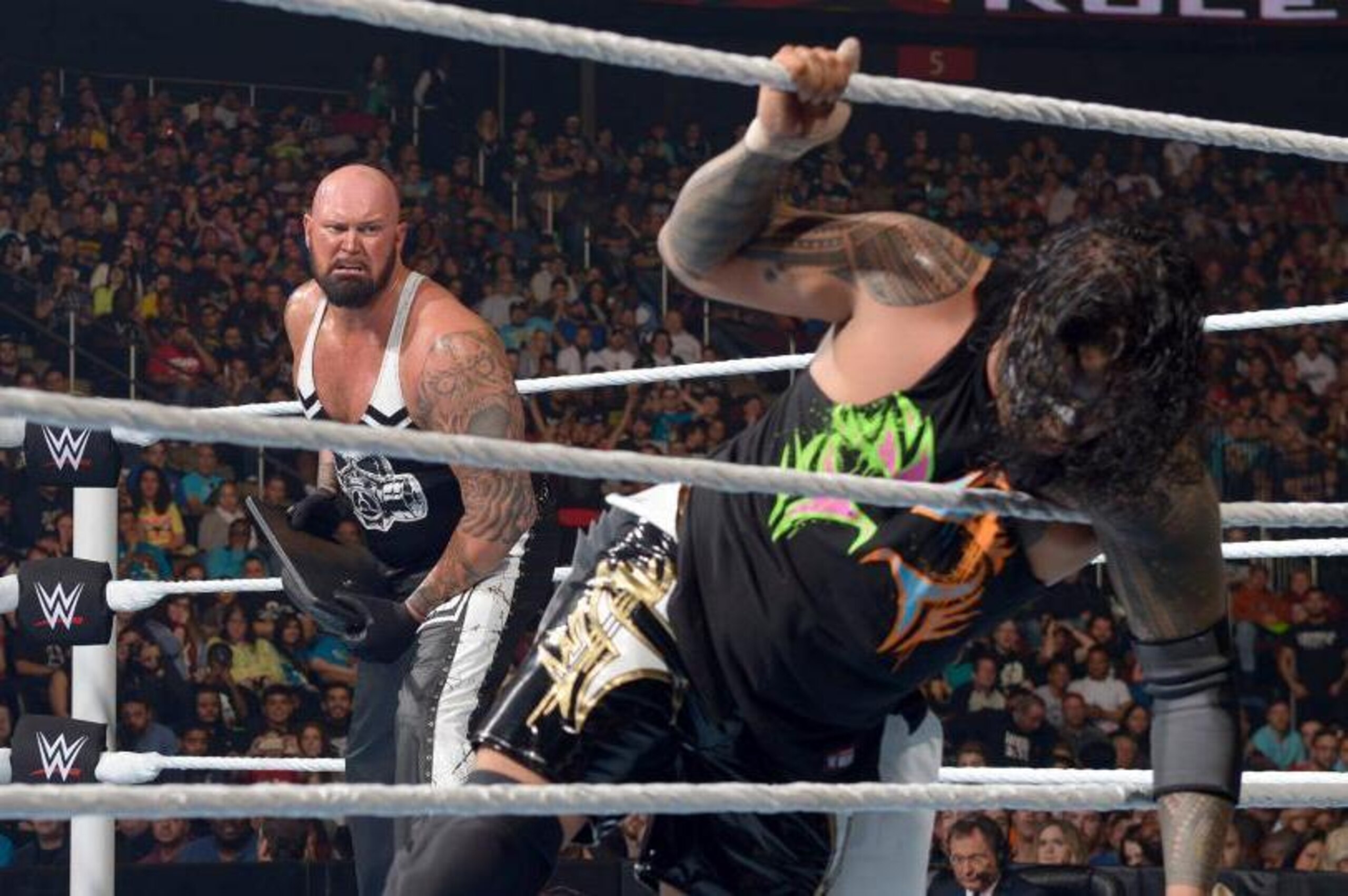 Luke Gallows prepares to attack Jimmy Uso.