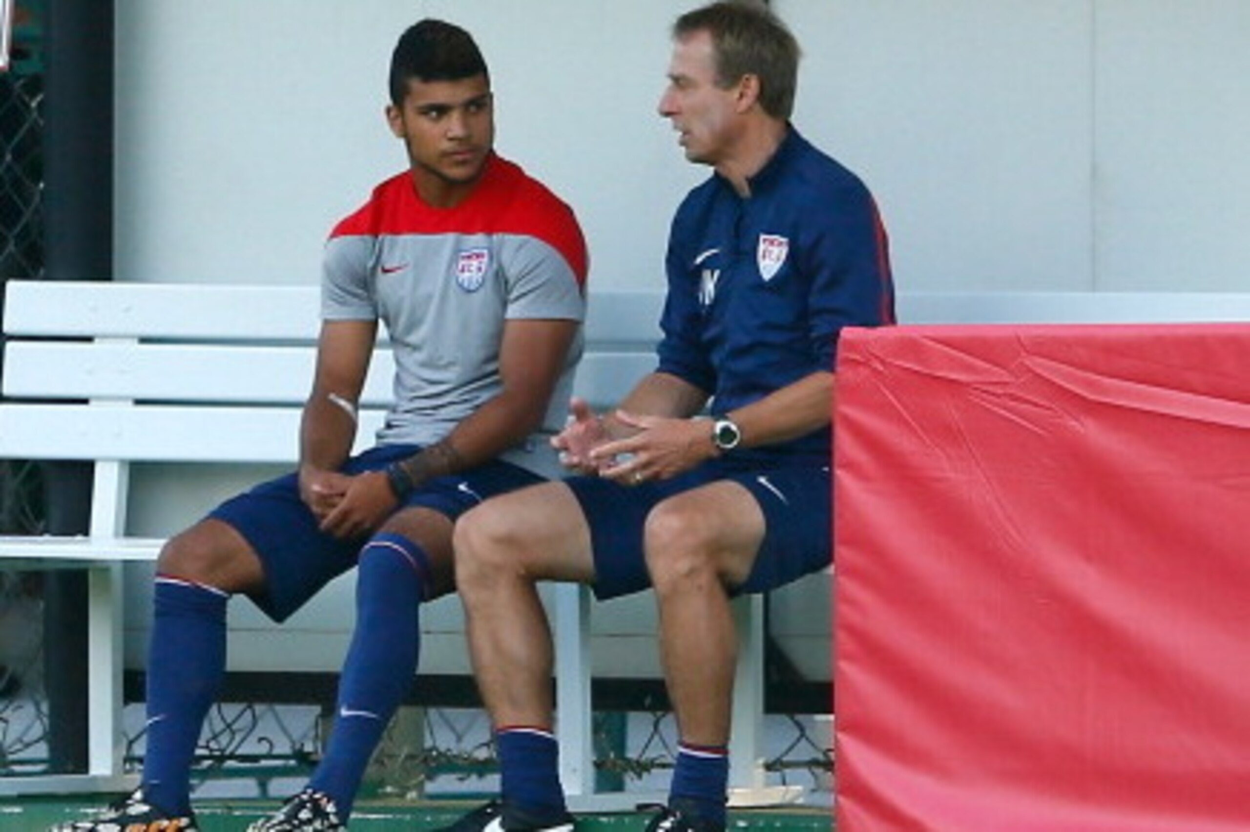 SAO PAULO, BRAZIL - JUNE 23:  Head coach Jurgen Klinsmann of the the United States speaks with DeAndre Yedlin prior to training at Sao Paulo FC on June 23, 2014 in Sao Paulo, Brazil.  (Photo by Kevin C. Cox/Getty Images)