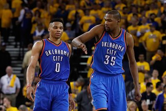 OAKLAND, CA - MAY 16:  Kevin Durant #35 (R) of the Oklahoma City Thunder celebrates with Russell Westbrook #0 during the final moments of game one of the NBA Western Conference Finals against the Golden State Warriors at ORACLE Arena on May 16, 2016 in Oa
