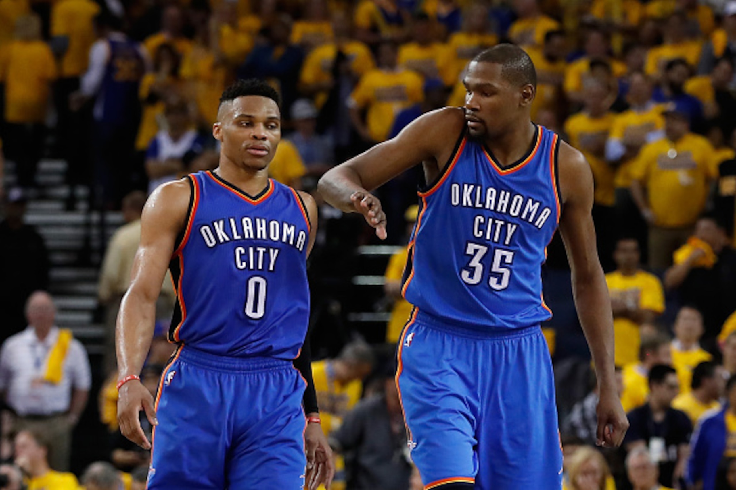 OAKLAND, CA - MAY 16:  Kevin Durant #35 (R) of the Oklahoma City Thunder celebrates with Russell Westbrook #0 during the final moments of game one of the NBA Western Conference Finals against the Golden State Warriors at ORACLE Arena on May 16, 2016 in Oa
