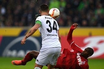 Cologne's French forward Anthony Modeste and Moenchengladbach's Swiss midfielder Granit Xhaka vie for the ball during the German first division Bundesliga football match Borussia Moenchengladbach vs 1. FC Cologne in Moenchengladbach , western Germany, on 