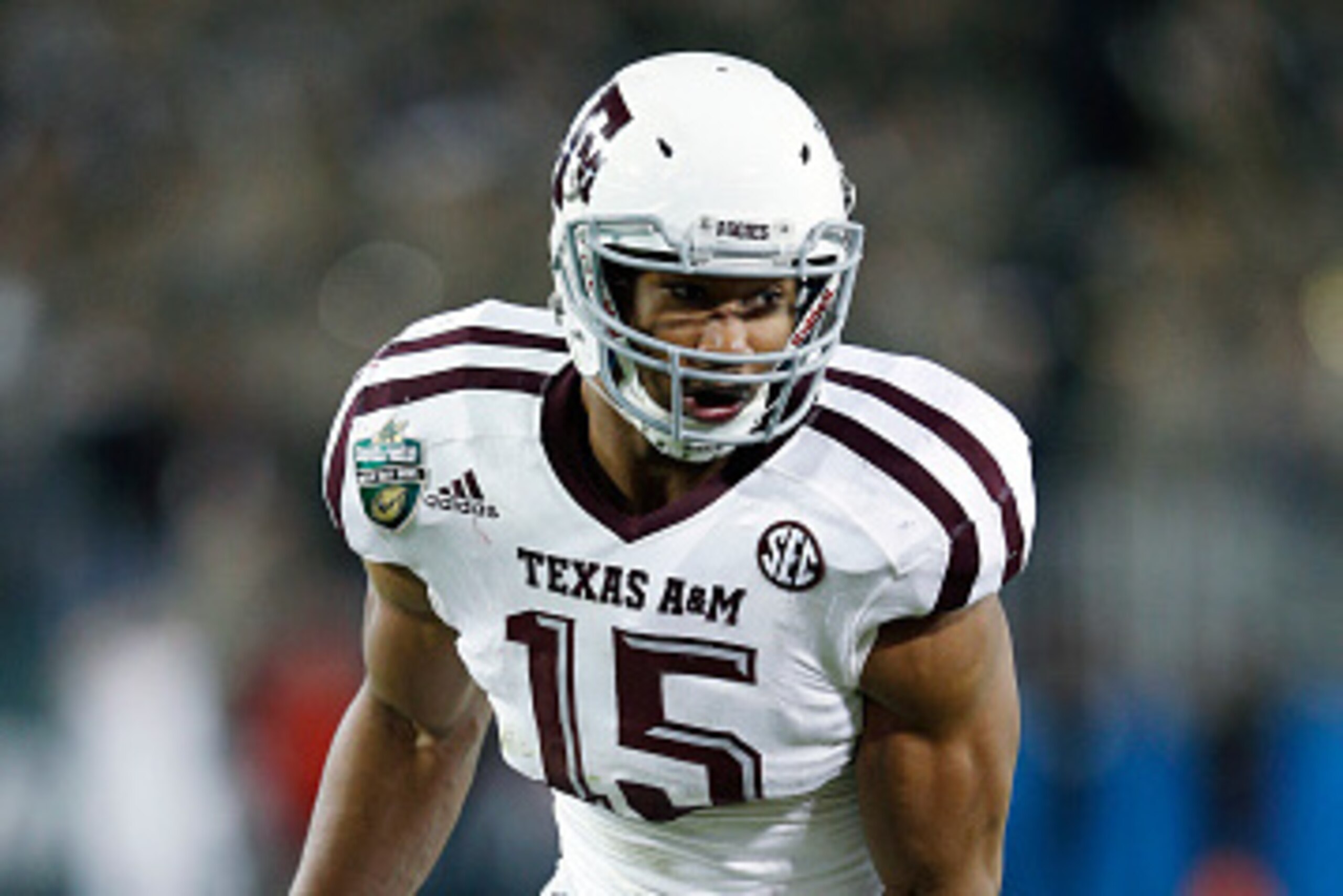 NASHVILLE, TN - DECEMBER 30: Myles Garrett #15 of the Texas A&M Aggies in action against the Louisville Cardinals during the Franklin American Mortgage Music City Bowl at Nissan Stadium on December 30, 2015 in Nashville, Tennessee. Louisville defeated Tex