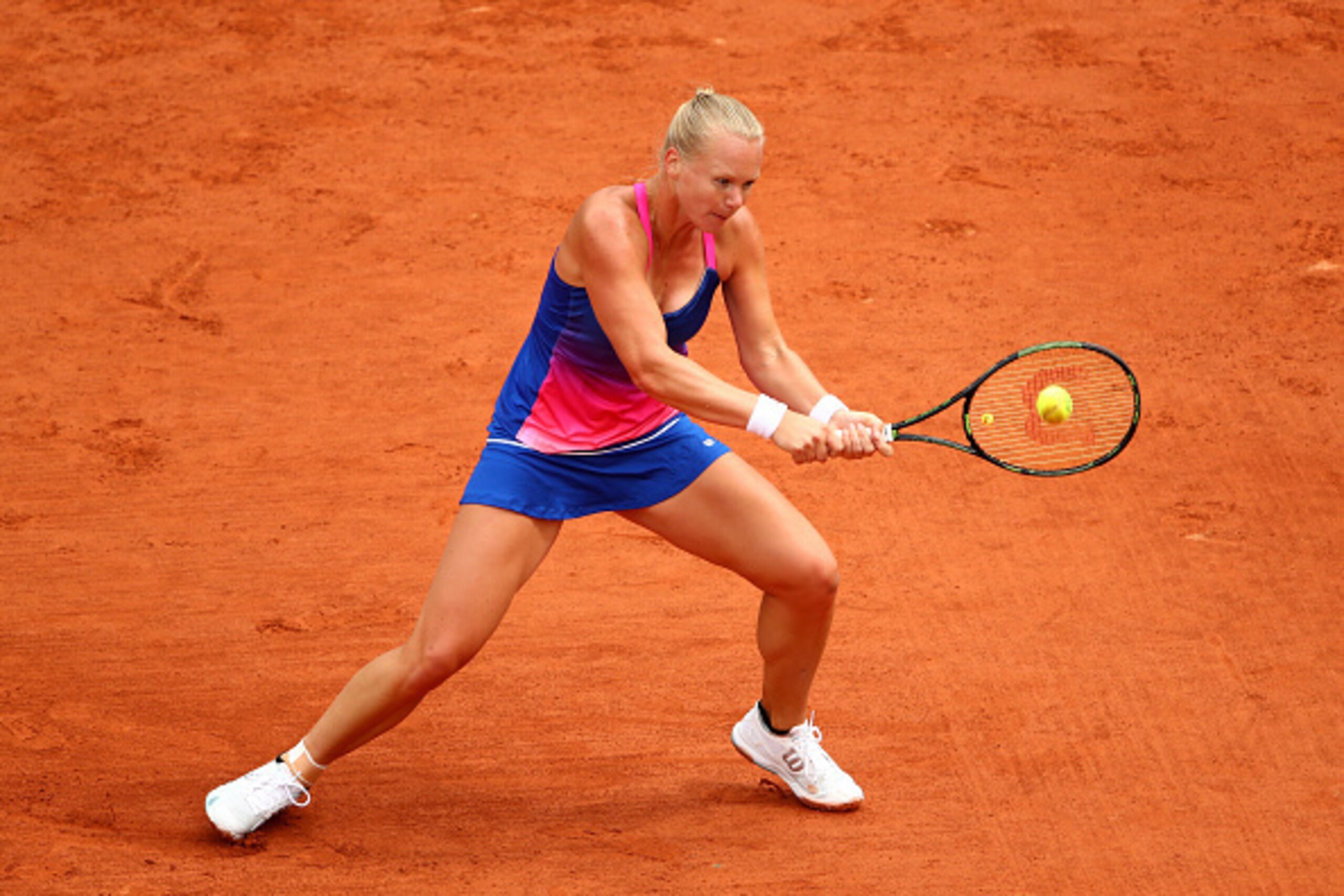 PARIS, FRANCE - MAY 24:  Kiki Bertens of the Netherlands plays a backhand during the Women's Singles first round match against Angelique Kerber of Germany on day three of the 2016 French Open at Roland Garros on May 24, 2016 in Paris, France.  (Photo by C