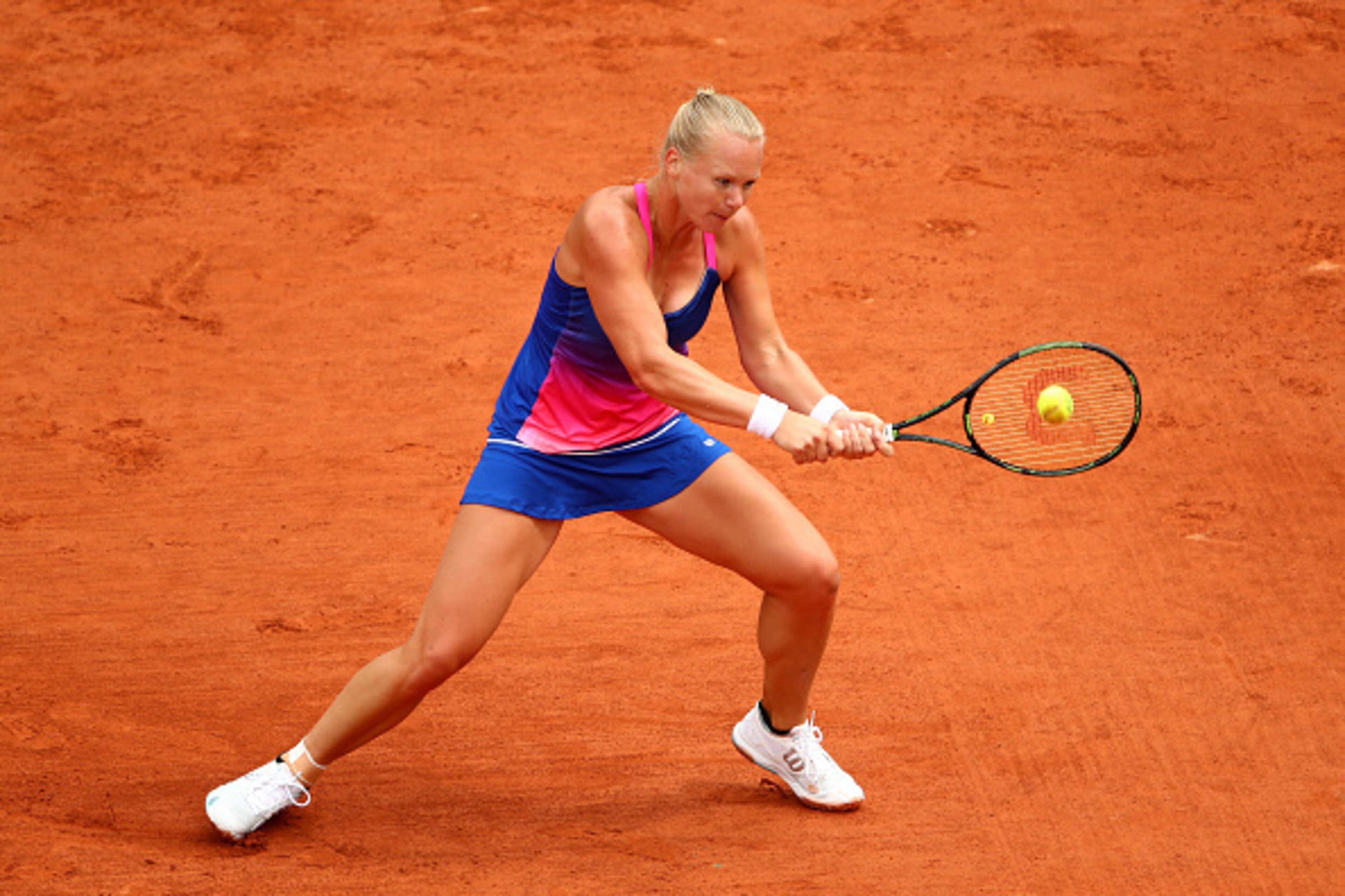 PARIS, FRANCE - MAY 24:  Kiki Bertens of the Netherlands plays a backhand during the Women's Singles first round match against Angelique Kerber of Germany on day three of the 2016 French Open at Roland Garros on May 24, 2016 in Paris, France.  (Photo by C
