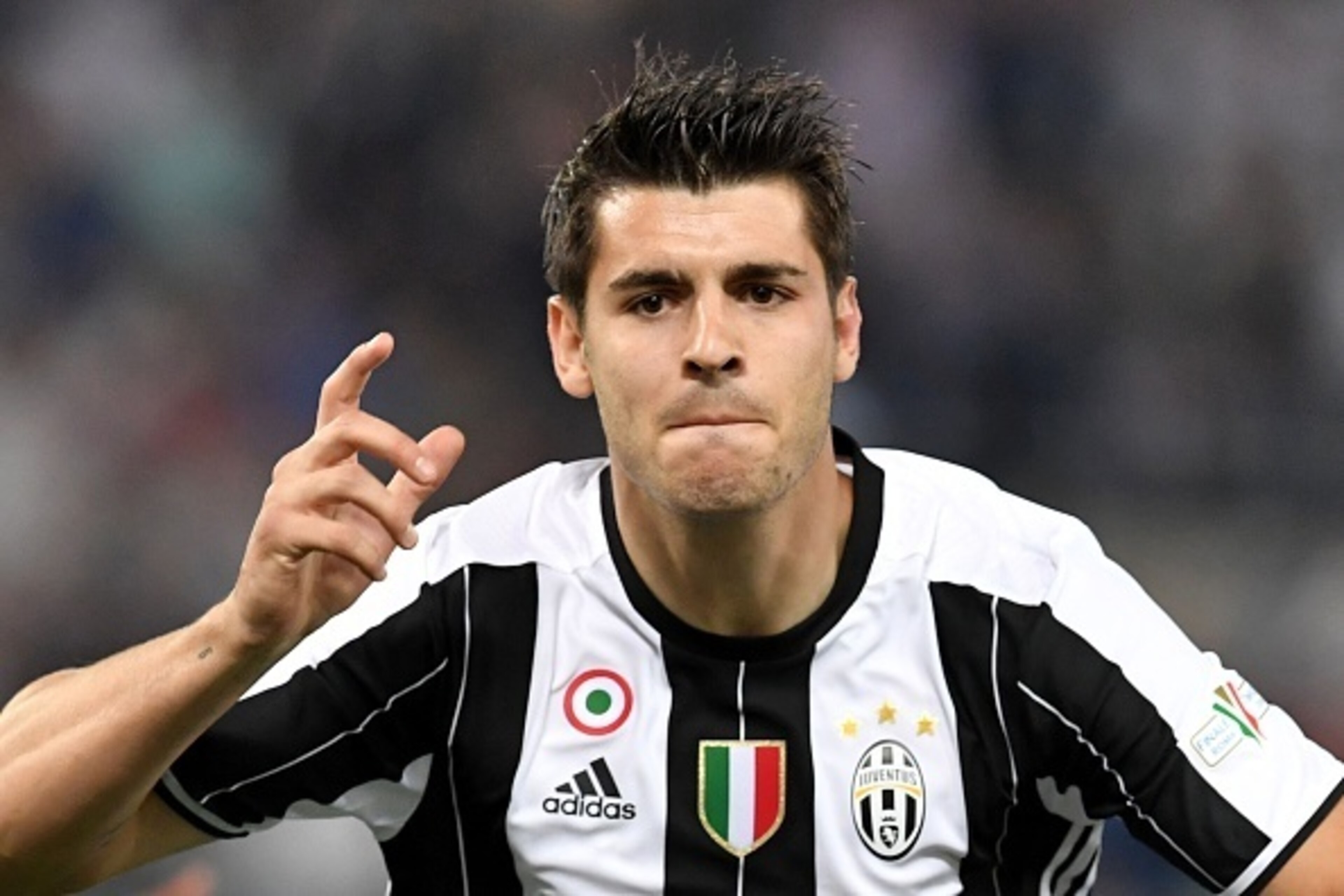 Juventus' forward from Spain Alvaro Morata celebrates after scoring during the Italian Tim Cup final football match AC Milan vs Juventus on May 21, 2016 at the Olympic Stadium in Rome. AFP PHOTO / TIZIANA FABI / AFP / TIZIANA FABI (Photo credit Juventus' forward from Spain Alvaro Morata celebrates after scoring during the Italian Tim Cup final football match AC Milan vs Juventus on May 21, 2016 at the Olympic Stadium in Rome. AFP PHOTO / TIZIANA FABI / AFP / TIZIANA FABI (Photo credit