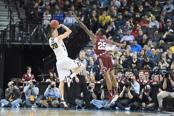 BROOKLYN, NY - MARCH 18:  Jarrod Uthoff #20 of the Iowa Hawkeyes takes a shot over Quenton DeCosey #25 of the Temple Owls during the first round of the 2016 NCAA Men's Basketball Tournament at Barclays Center on March 18, 2016 in the Brooklyn borough of N