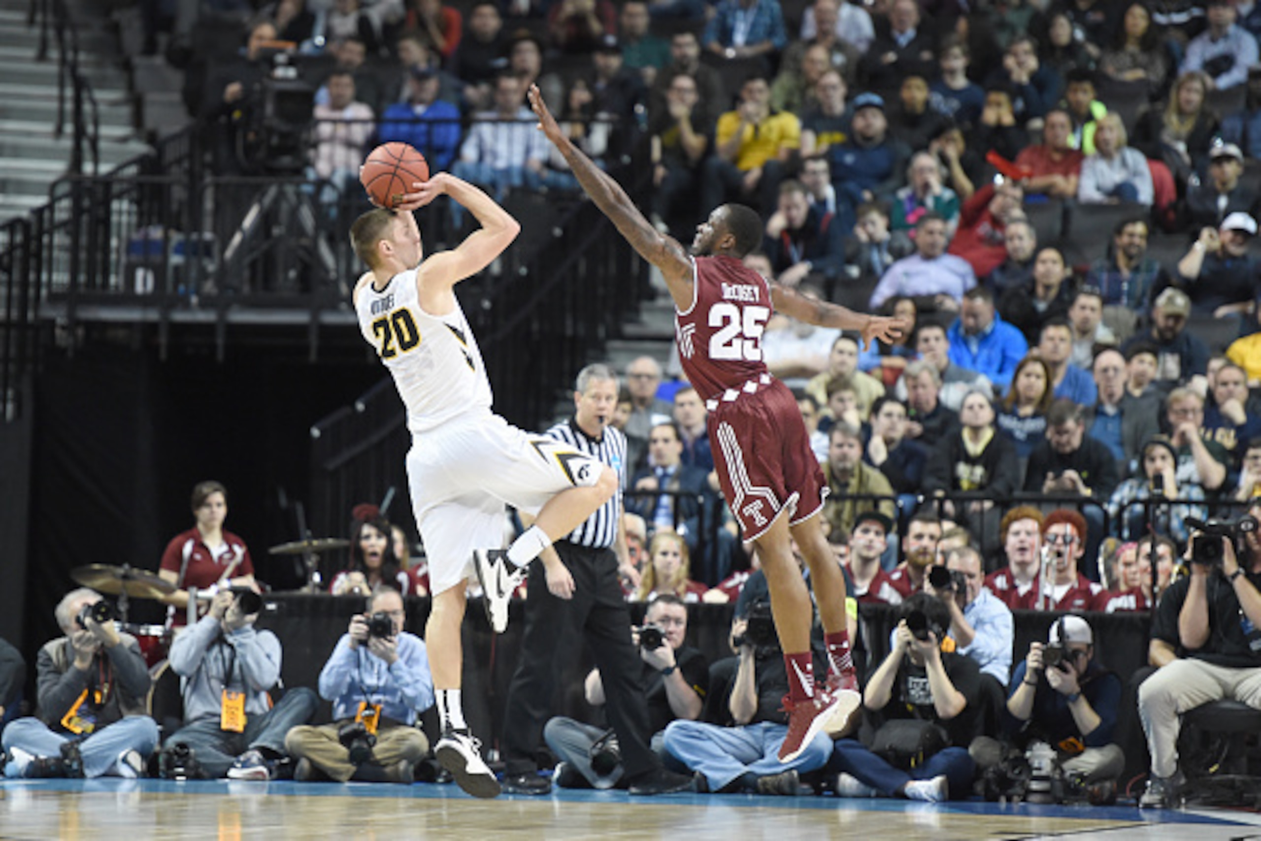 BROOKLYN, NY - MARCH 18:  Jarrod Uthoff #20 of the Iowa Hawkeyes takes a shot over Quenton DeCosey #25 of the Temple Owls during the first round of the 2016 NCAA Men's Basketball Tournament at Barclays Center on March 18, 2016 in the Brooklyn borough of N