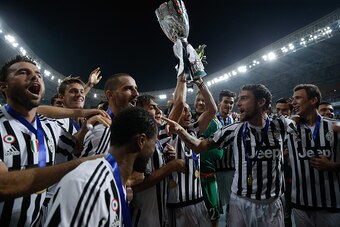 SHANGHAI, CHINA - AUGUST 08:  Martin Caceres (C) of Juventus celebrates with with teammates after winning the Italian Super Cup final football match between Juventus and Lazio at Shanghai Stadium on August 8, 2015 in Shanghai, China.  (Photo by Lintao Zha
