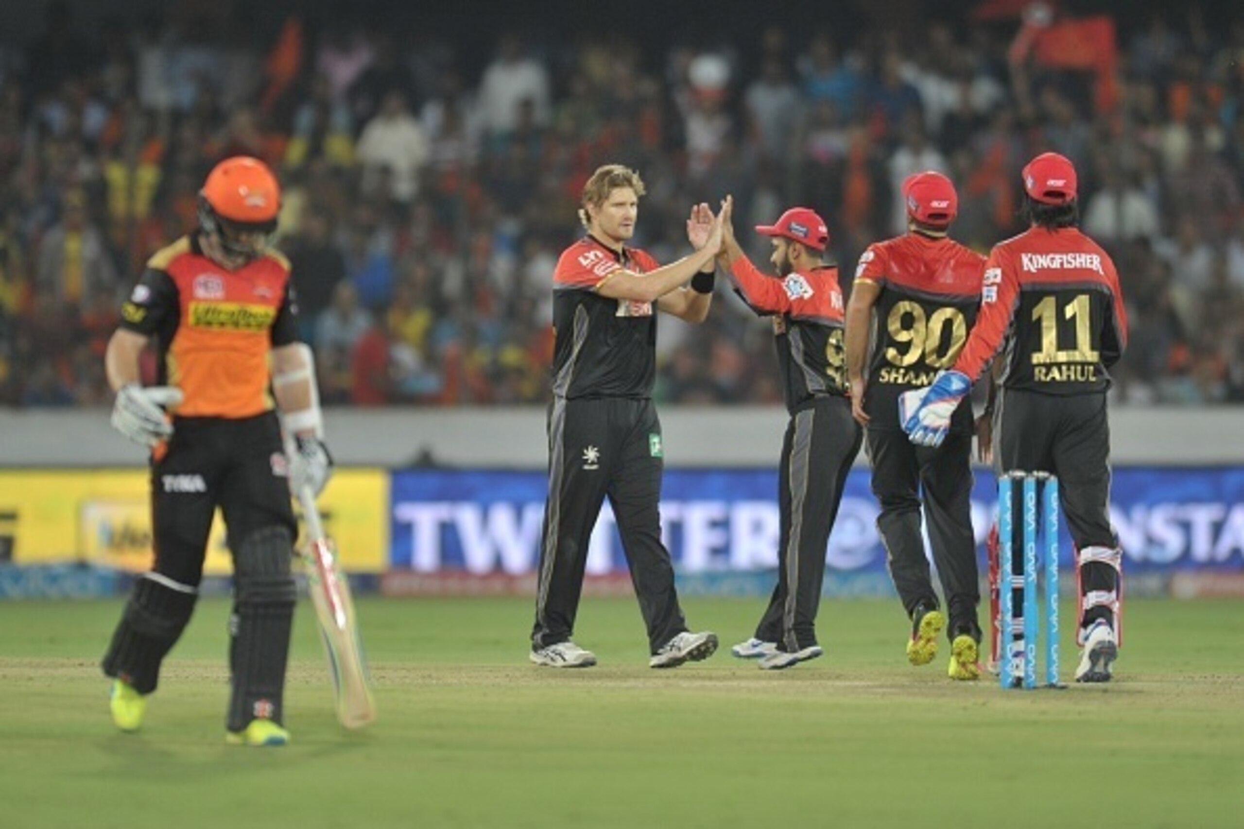 Royal Challengers Bangalore bowler Shane Watson(2L) celebrates the wicket of Kane Williamson of Sunrisers Hyderabad during the 2016 Indian Premier League (IPL) Twenty20 cricket match between Sunrisers Hyderabad and Royal Challengers Bangalore at The Rajiv
