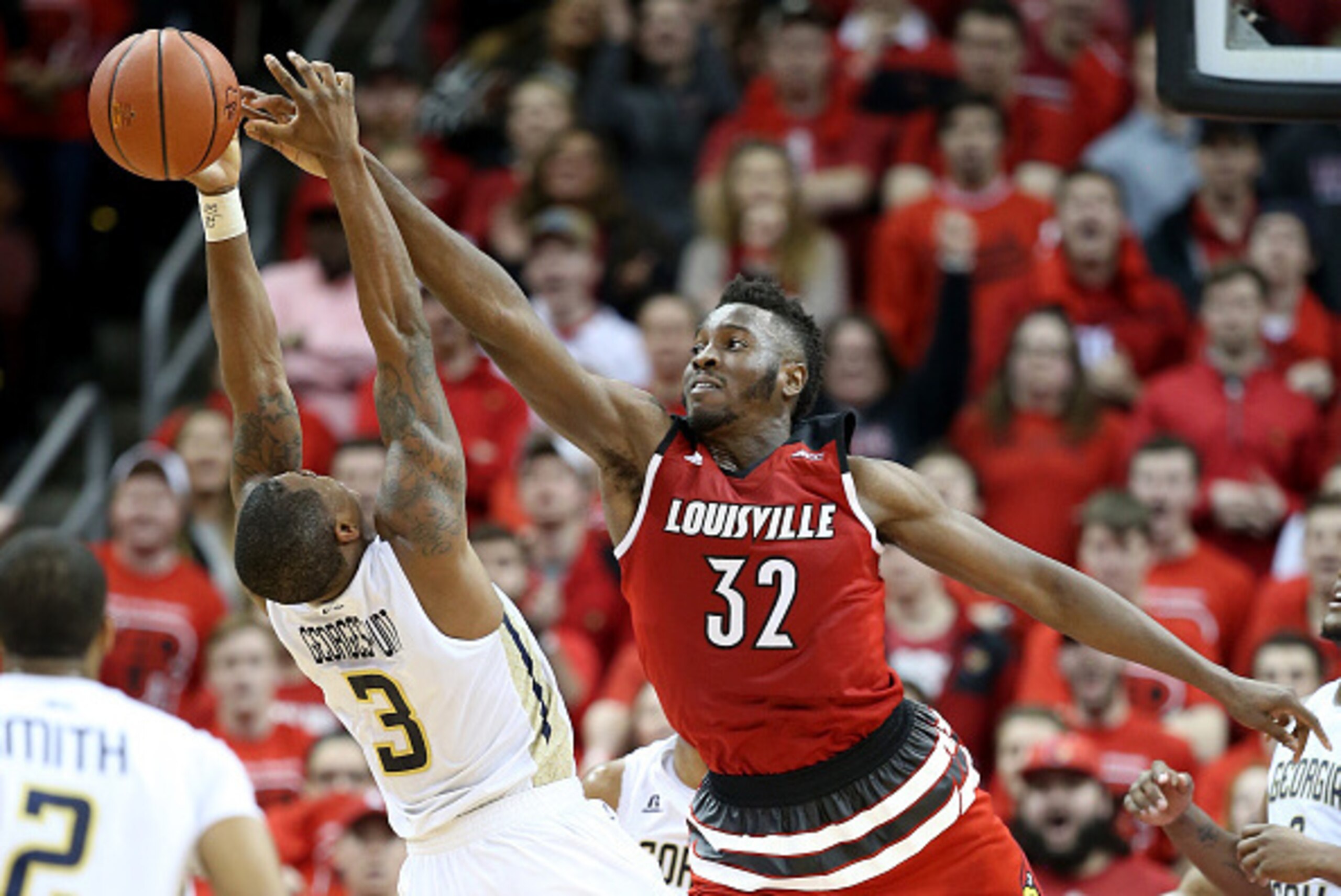 LOUISVILLE, KY - MARCH 01:  Chinanu Onuaku #32 of the Louisville Cardinals blocks the shot of Marcus Georges-Hunt #3 of the Georgia Tech Yellow Jackets during the game at KFC YUM! Center on March 1, 2016 in Louisville, Kentucky.  (Photo by Andy Lyons/Gett