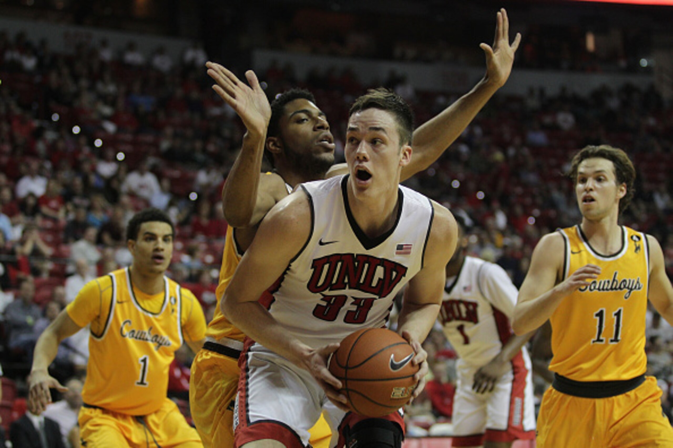 LAS VEGAS, NV - FEBRUARY 27:  Jordon Naughton #33 of the Wyoming Cowboys guards Stephen Zimmerman Jr. #33 of the UNLV Rebels during their game at the Thomas & Mack Center on February 27, 2016 in Las Vegas, Nevada.  (Photo by John Gurzinski/Getty Images)