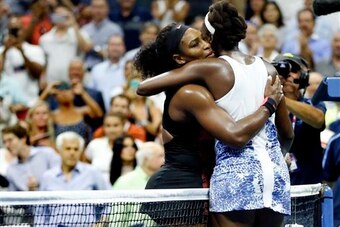 Serena Williams hugs sister Venus after their match at the 2015 U.S. Open.
