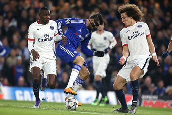 LONDON, ENGLAND - MARCH 9: Diego Costa of Chelsea in action between Blaise Matuidi and David Luiz of PSG during the UEFA Champions League round of 16 second leg match between Chelsea FC and Paris Saint-Germain at Stamford Bridge stadium on March 9, 2016 i