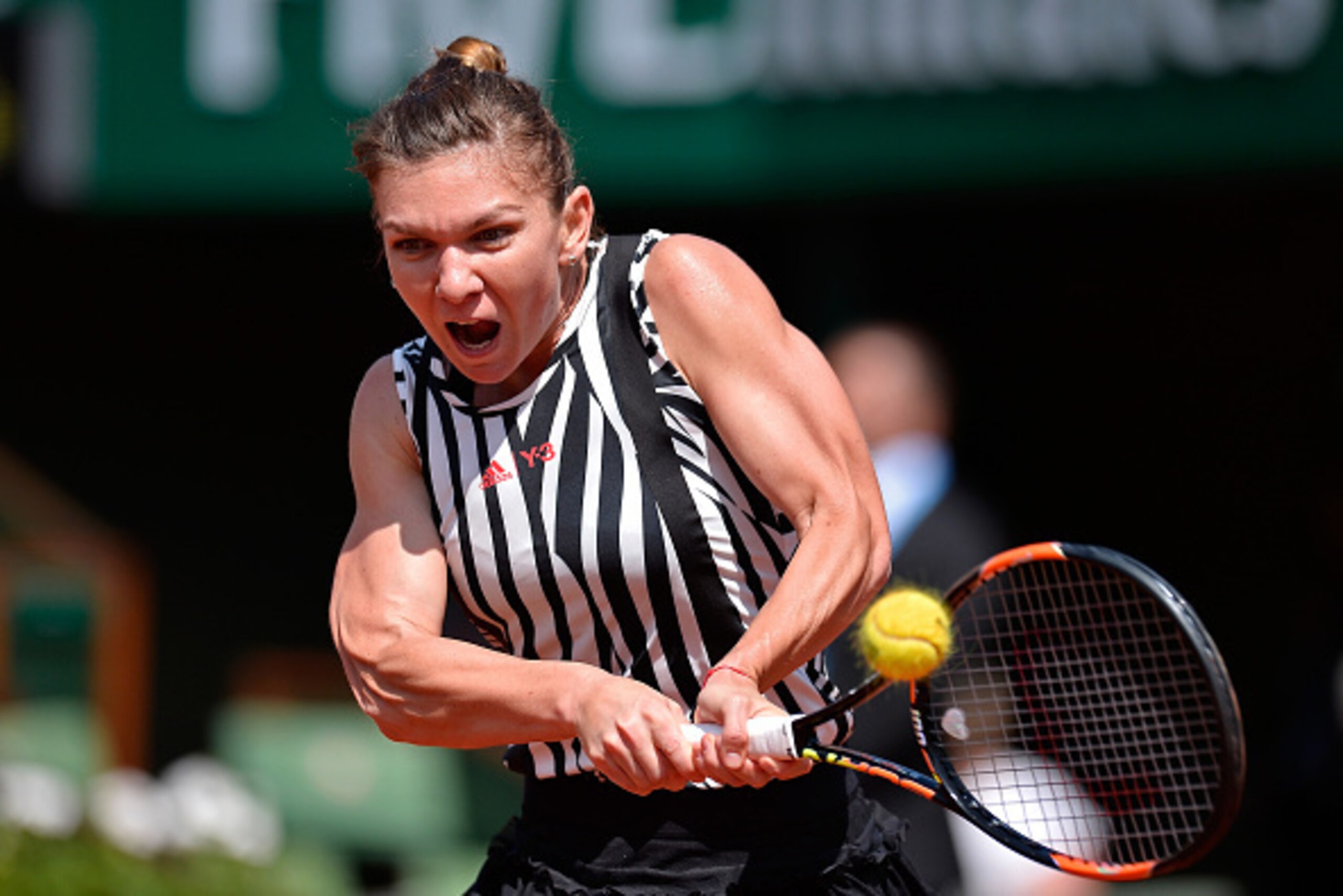 PARIS, FRANCE - MAY 25:  Simona Halep of Romania plays a backhand during her women's single second round match against Zarina Diyas of Kazakhstan on day four of the 2016 French Open at Roland Garros on May 25, 2016 in Paris, France.  (Photo by Aurelien Me