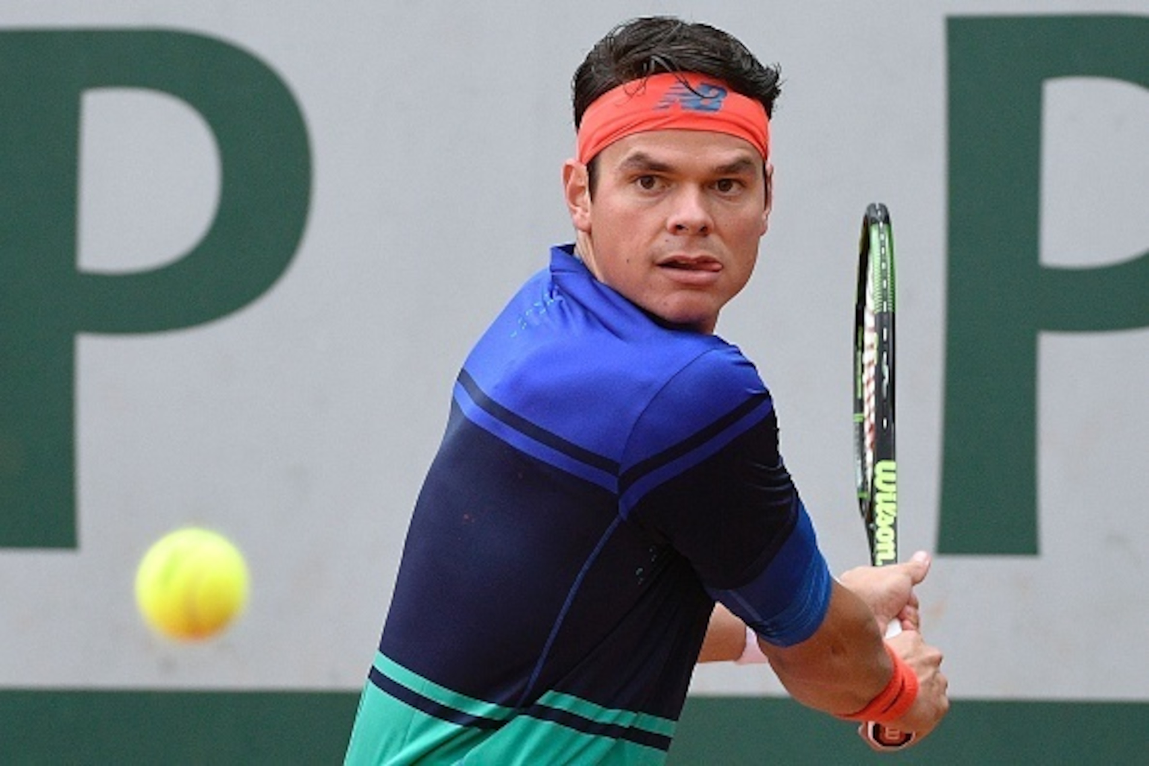 Canada's Milos Raonic returns the ball to Serbia's Janko Tipsarevic during their men's first round match at the Roland Garros 2016 French Tennis Open in Paris on May 23, 2016. / AFP / MARTIN BUREAU (Photo credit should read MARTIN BUREAU/AFP/Getty Canada's Milos Raonic returns the ball to Serbia's Janko Tipsarevic during their men's first round match at the Roland Garros 2016 French Tennis Open in Paris on May 23, 2016. / AFP / MARTIN BUREAU (Photo credit should read MARTIN BUREAU/AFP/Getty
