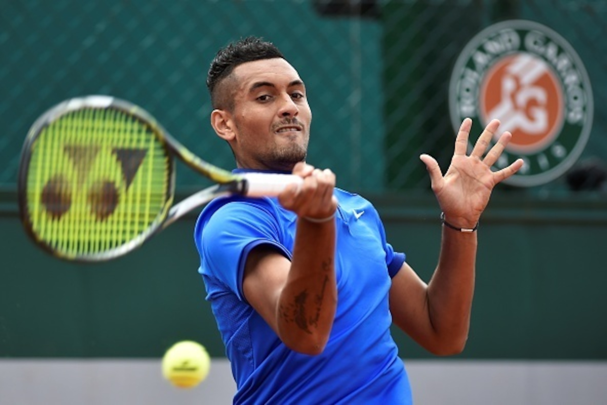 Australia's Nick Kyrgios returns the ball to Netherlands' Igor Sijsling during their men's second round match at the Roland Garros 2016 French Tennis Open in Paris on May 25, 2016. / AFP / Eric FEFERBERG        (Photo credit should read ERIC FEFERBERG/AFP