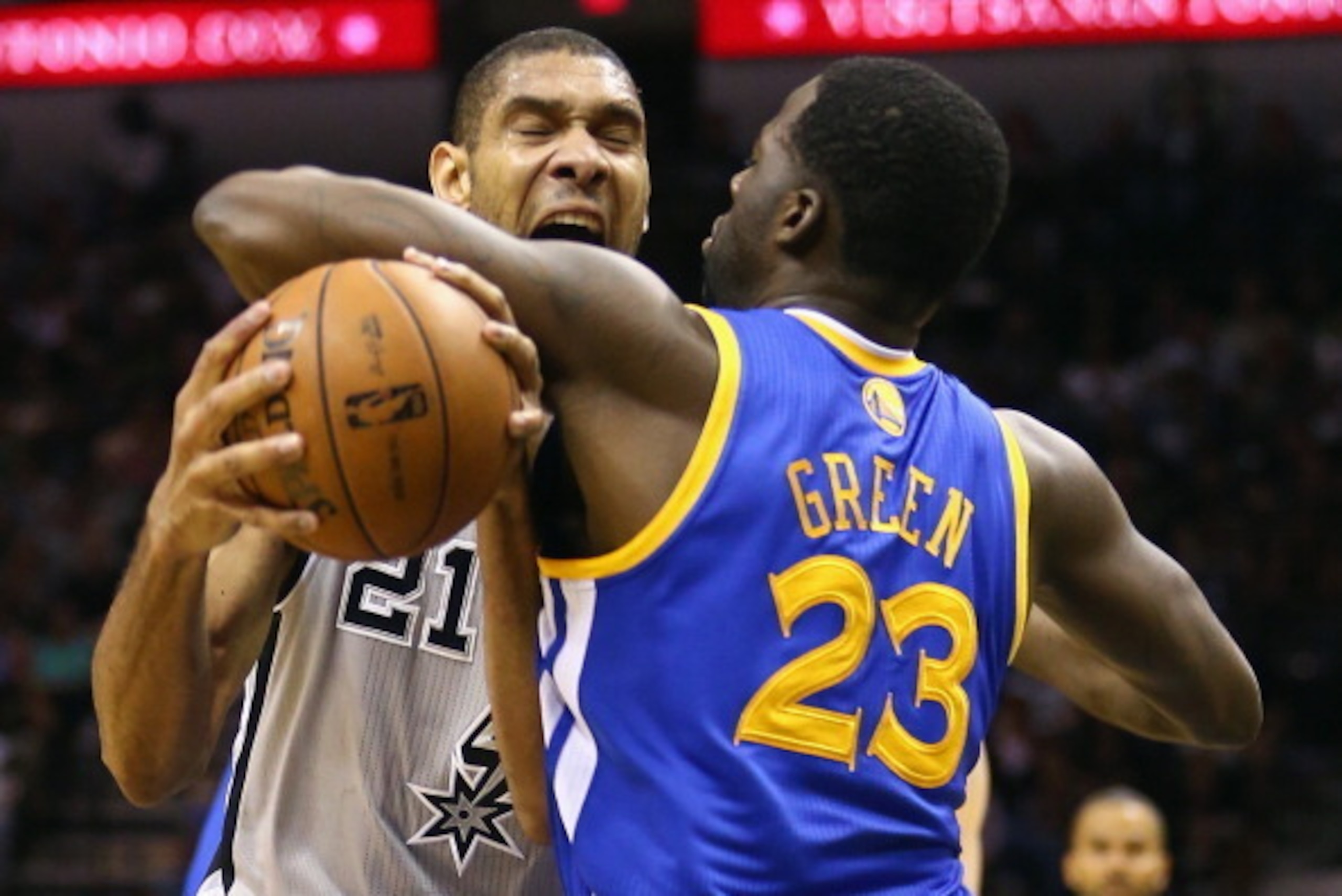 SAN ANTONIO, TX - MAY 08:  Tim Duncan #21 of the San Antonio Spurs is fouled by Draymond Green #23 of the Golden State Warriors during Game Two of the Western Conference Semifinals of the 2013 NBA Playoffs at AT&T Center on May 8, 2013 in San Antonio, Tex