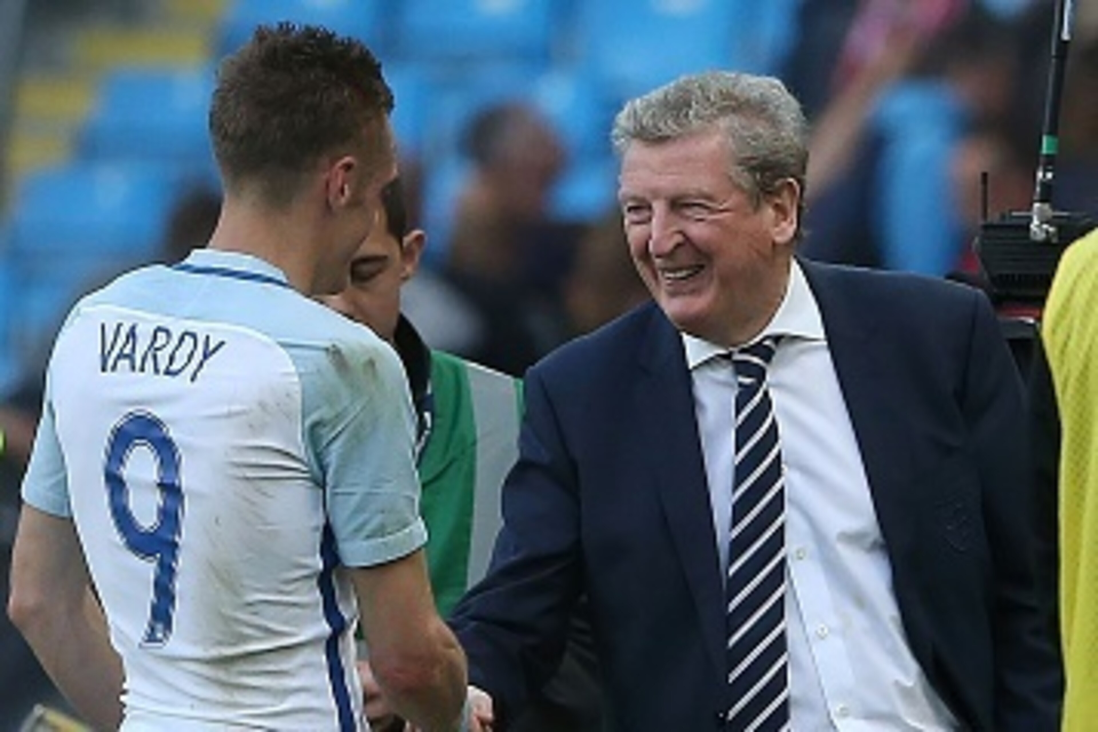 England's manager Roy Hodgson (R) congratulates England's striker Jamie Vardy following the friendly football match between England and Turkey at the Etihad Stadium in Manchester, north west England, on May 22, 2016.
England won the match 2-1. / AFP / Sco