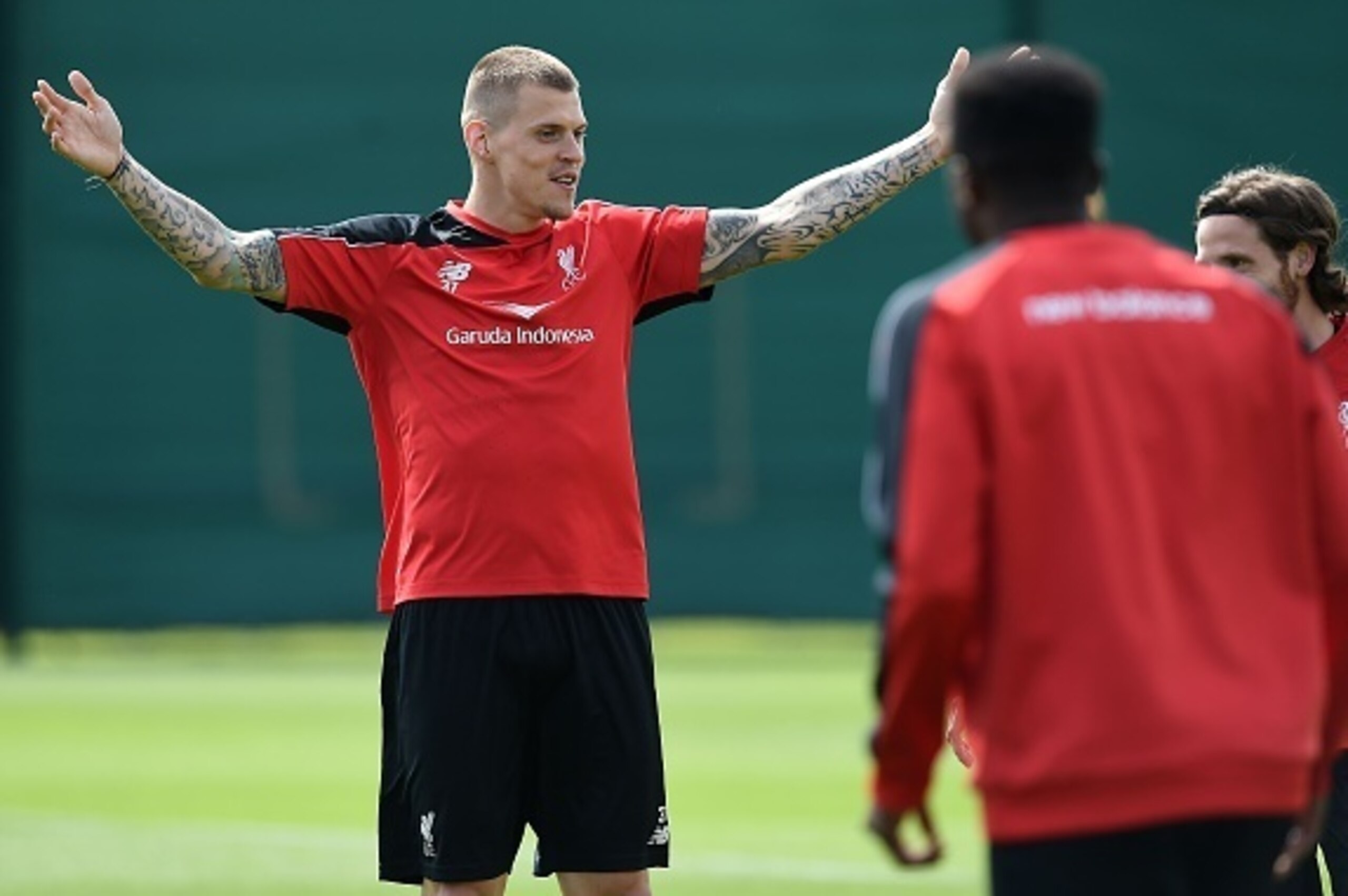 Liverpool's Slovakian defender Martin Skrtel (L) gestures during a team training session at their Melwood training complex in Liverpool, north west England, on May 13, 2016.
Liverpool face Sevilla in the Europa League final on May 18, 2016, with both silv