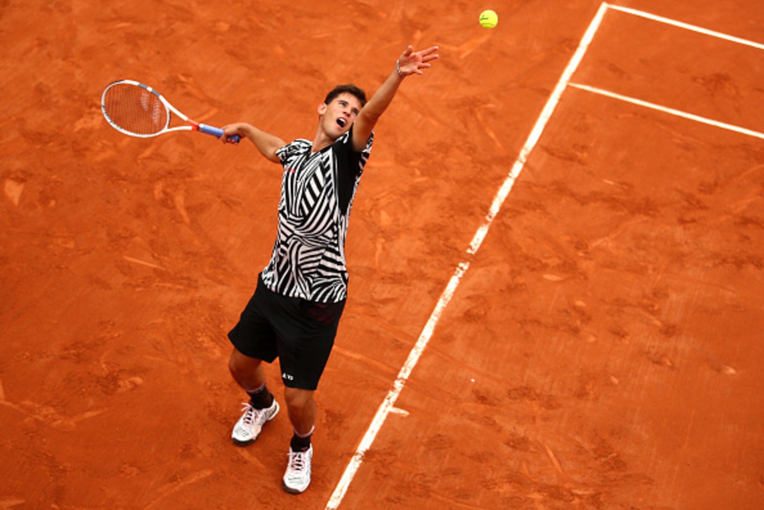 PARIS, FRANCE - MAY 26:  Dominic Thiem of Austria hits a forehand during the Men's Singles second round match against Guillermo Garcia-Lopez of Spain on day five of the 2016 French Open at Roland Garros on May 26, 2016 in Paris, France.  (Photo by Clive B